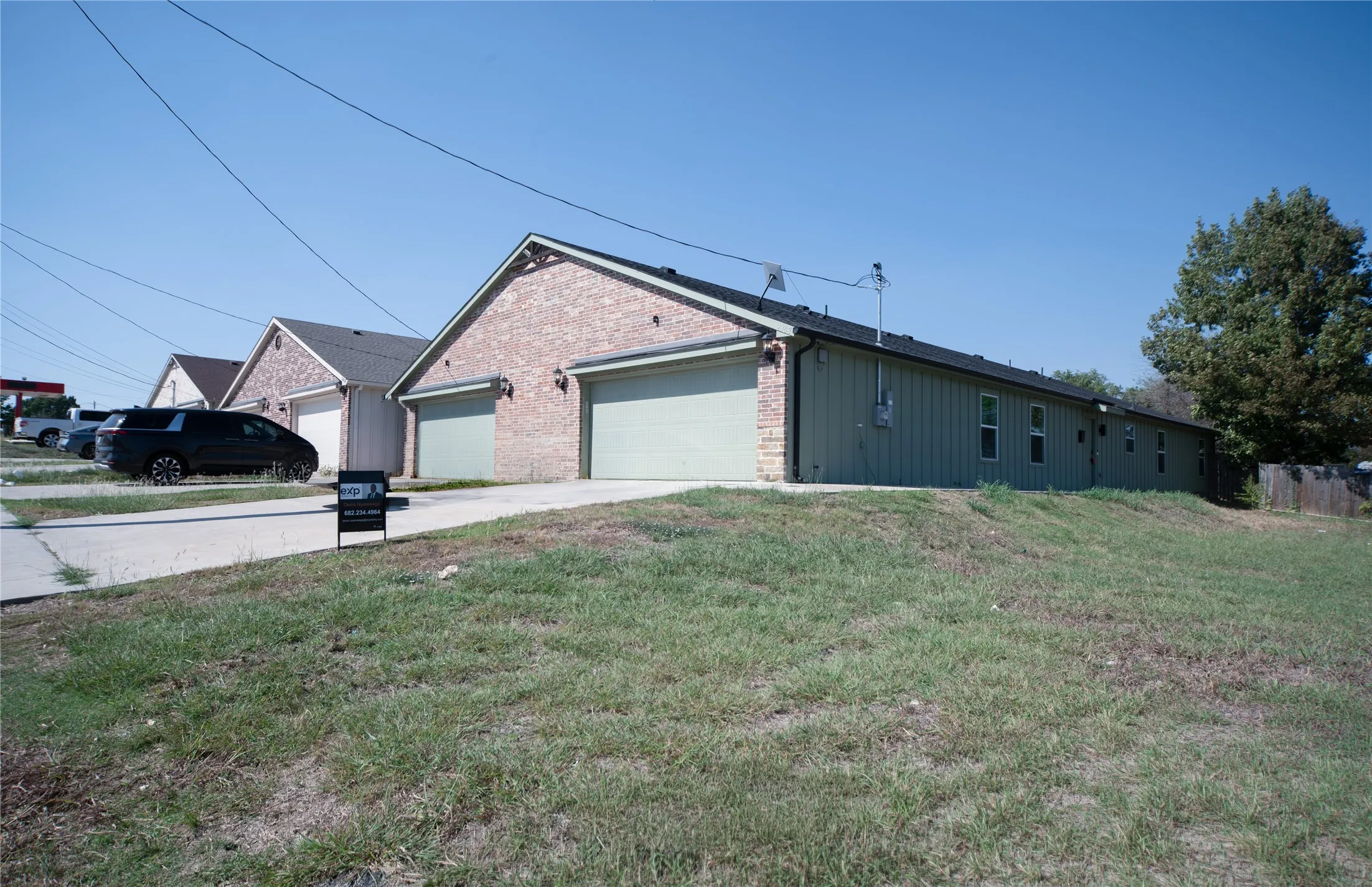 Brick exterior with gabled roofline and attached two-car garage