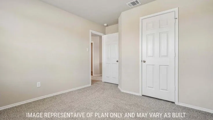Wall-to-wall carpeting, light neutral wall colors, and white trim