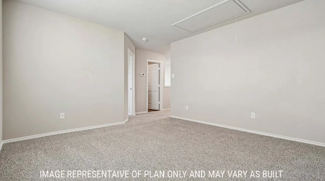 Carpeted flooring, light-toned walls, and recessed lighting