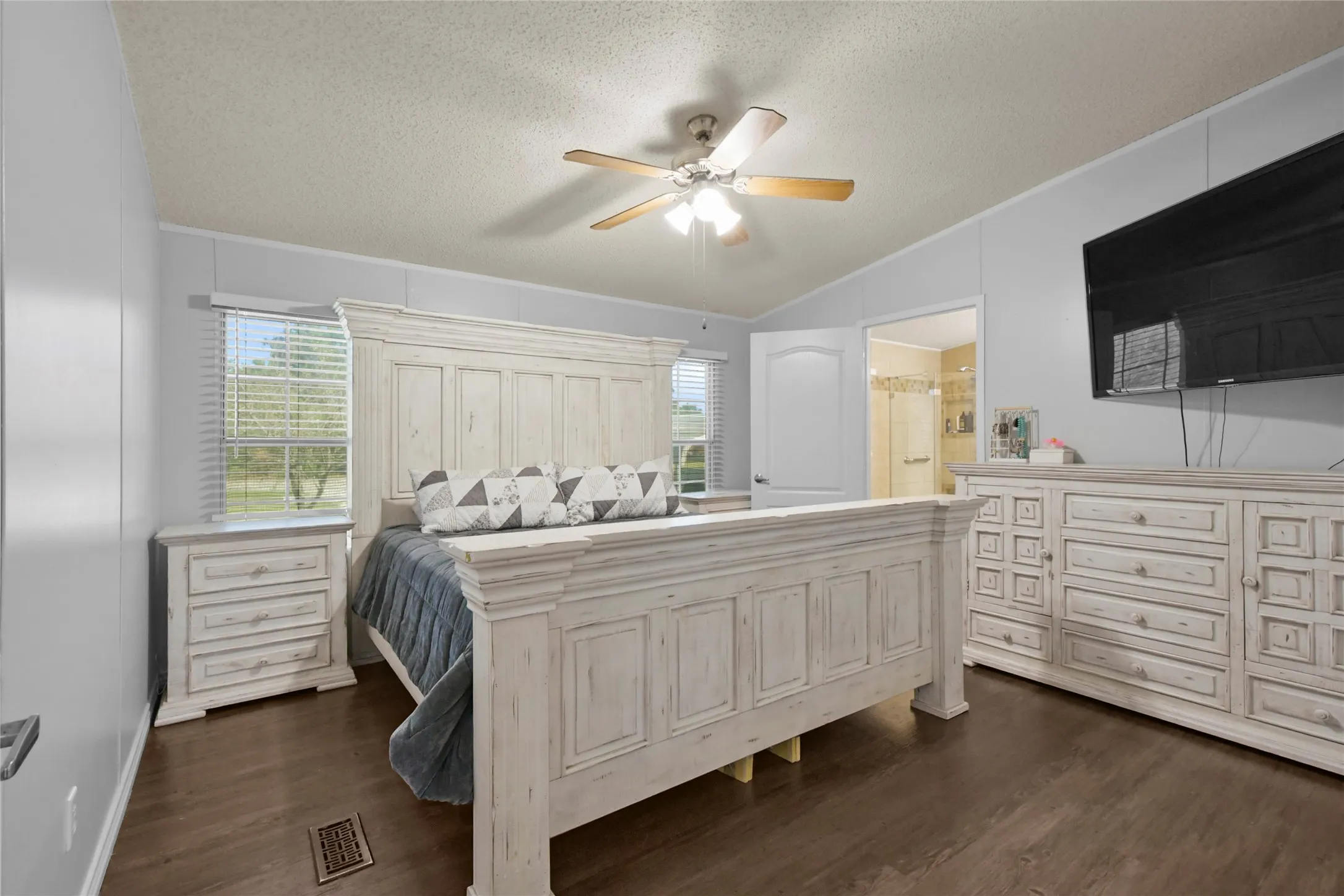 Rich wood-finish flooring complements the light wall paneling