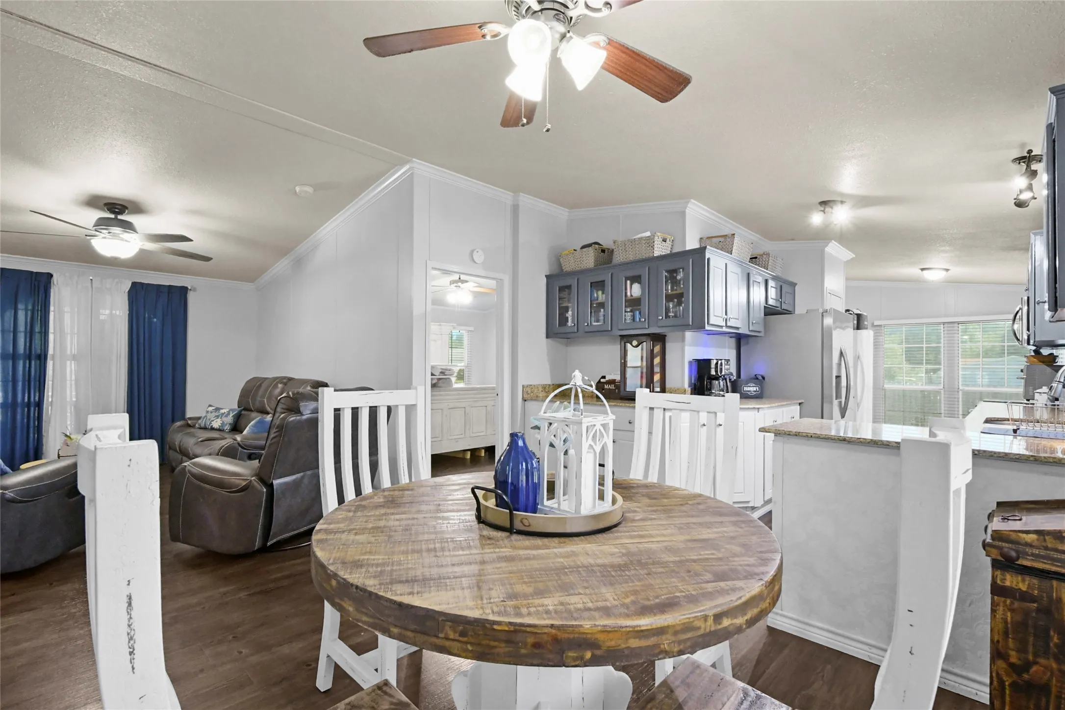 Open concept living area with wood-finish flooring
