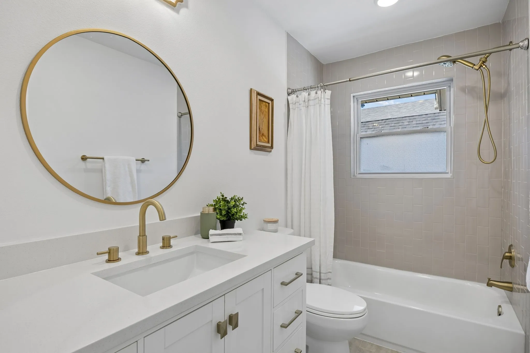 Secondary bathroom completely renovated and designed to maximize the space.  Lots of storage here
