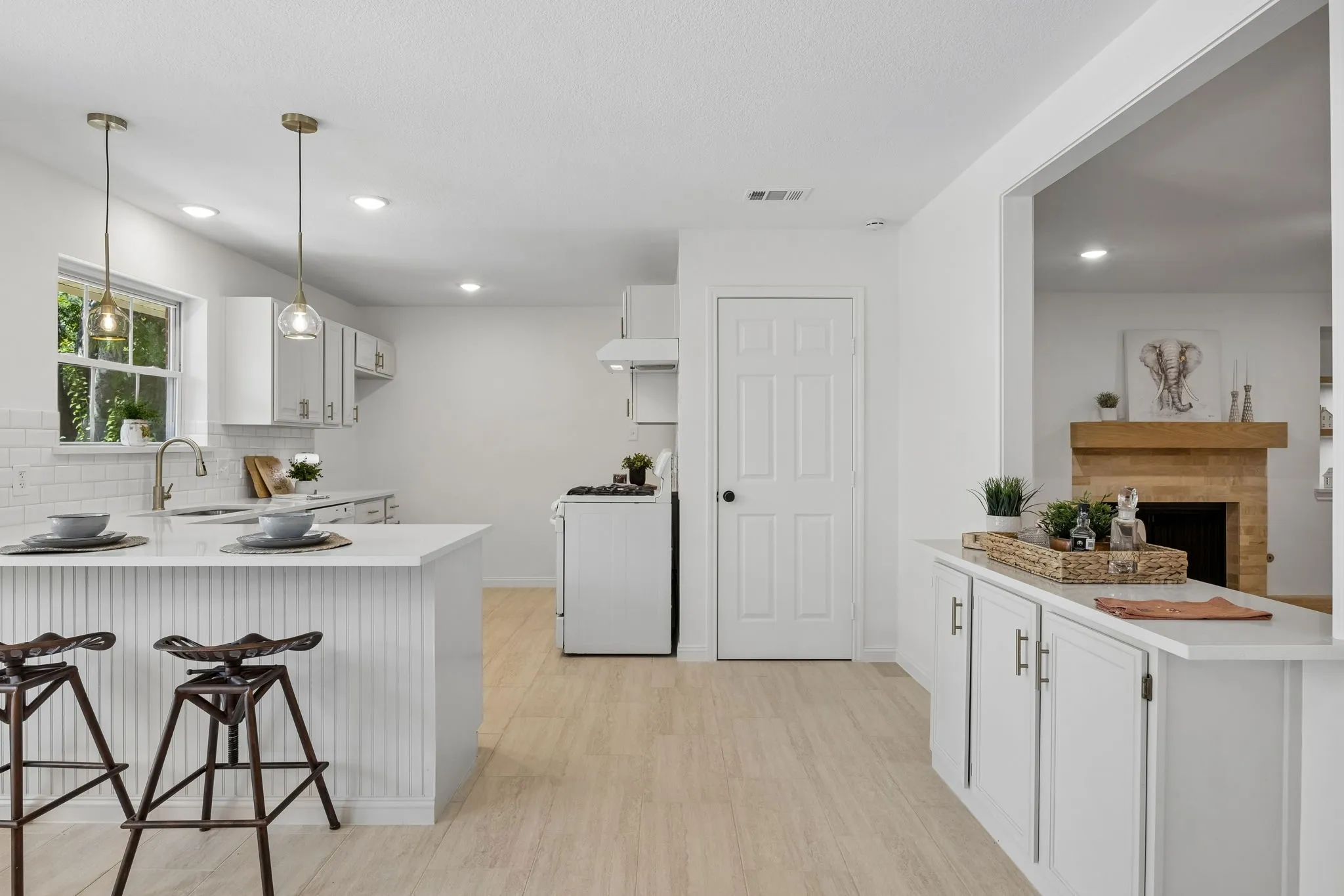 Coffee bar with additional storage or dry bar for easy flow entertainment .   I love how this space is open to the living room and yet still maintains the charm of home