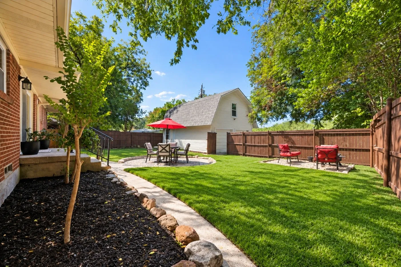 DIGITALLY ENHANCED . This is NOT what the grass  looks like currently - but it certainly could with some time and cooler weather.    New seed has be laid in both front and back yard.