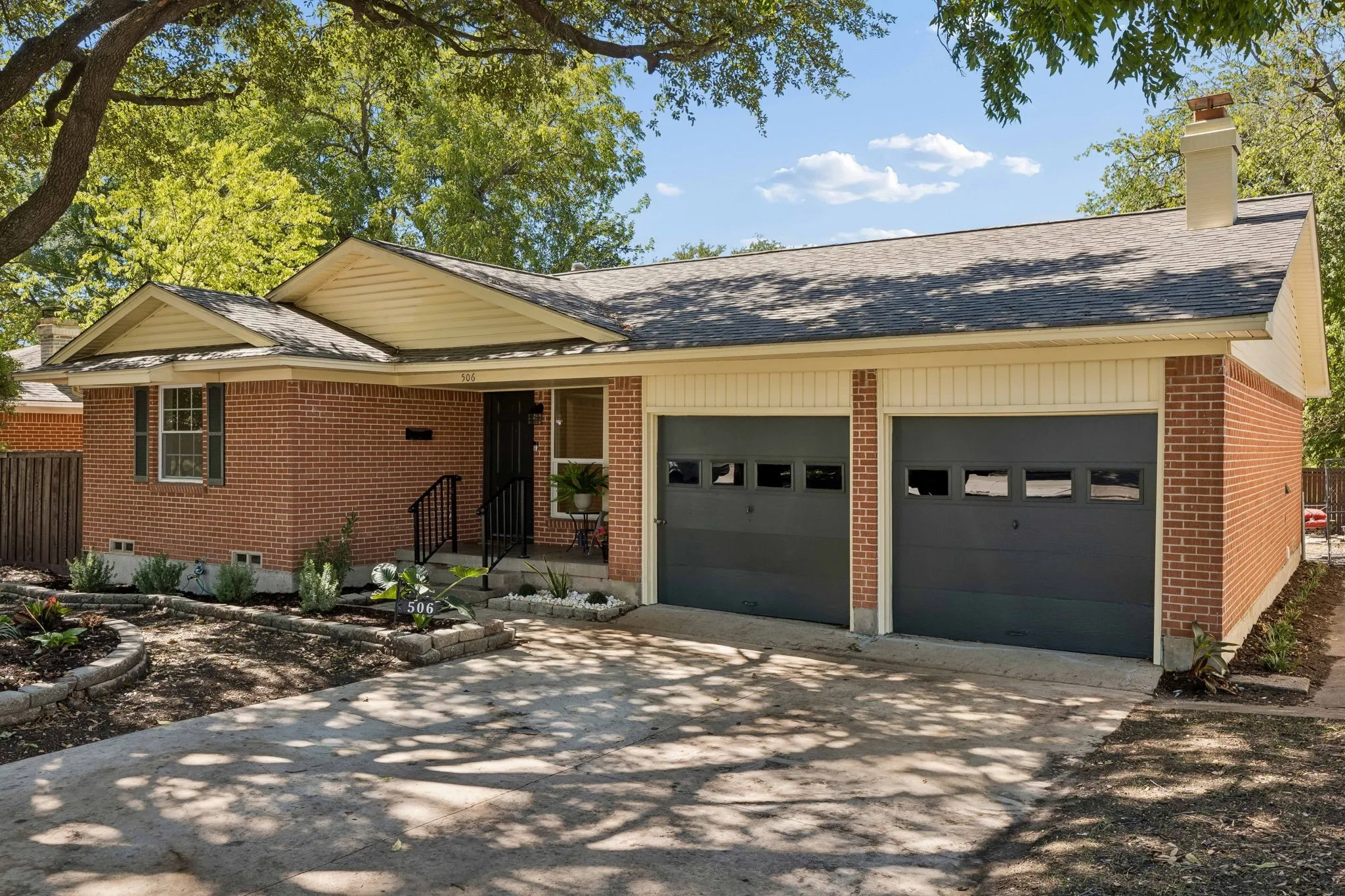 Oversized driveway and an additional 2 car detached garage, ffstreet parking is never a problem here.  Faux garage doors here offer an additional storage 3 ft deep.