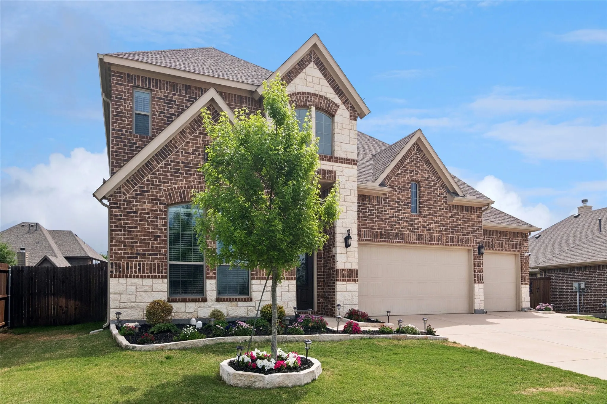 Brick and stone facade with gabled roof lines