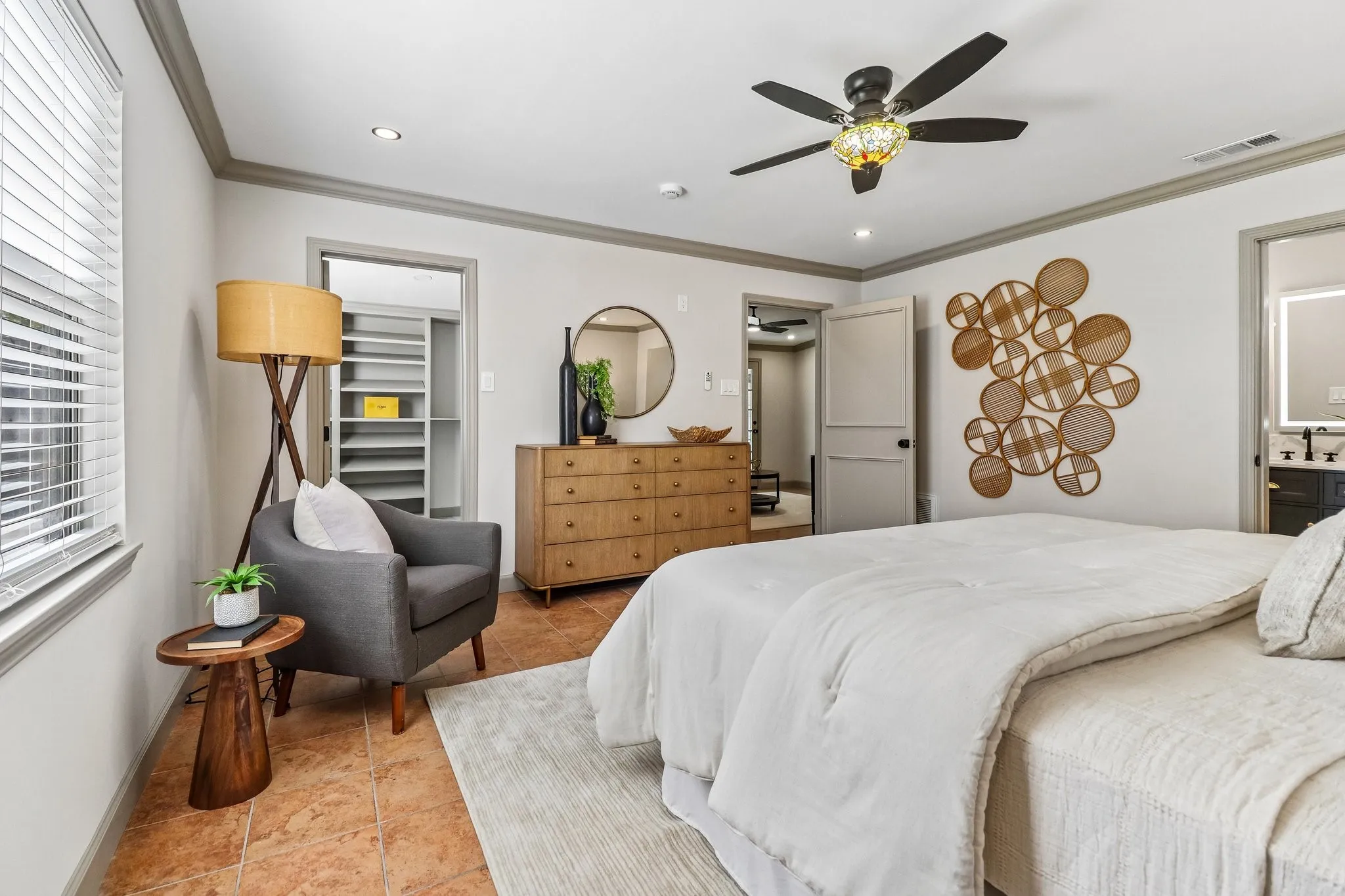 Recessed lighting, ceiling fan with decorative light fixture, built-in closet shelving, and tiled flooring