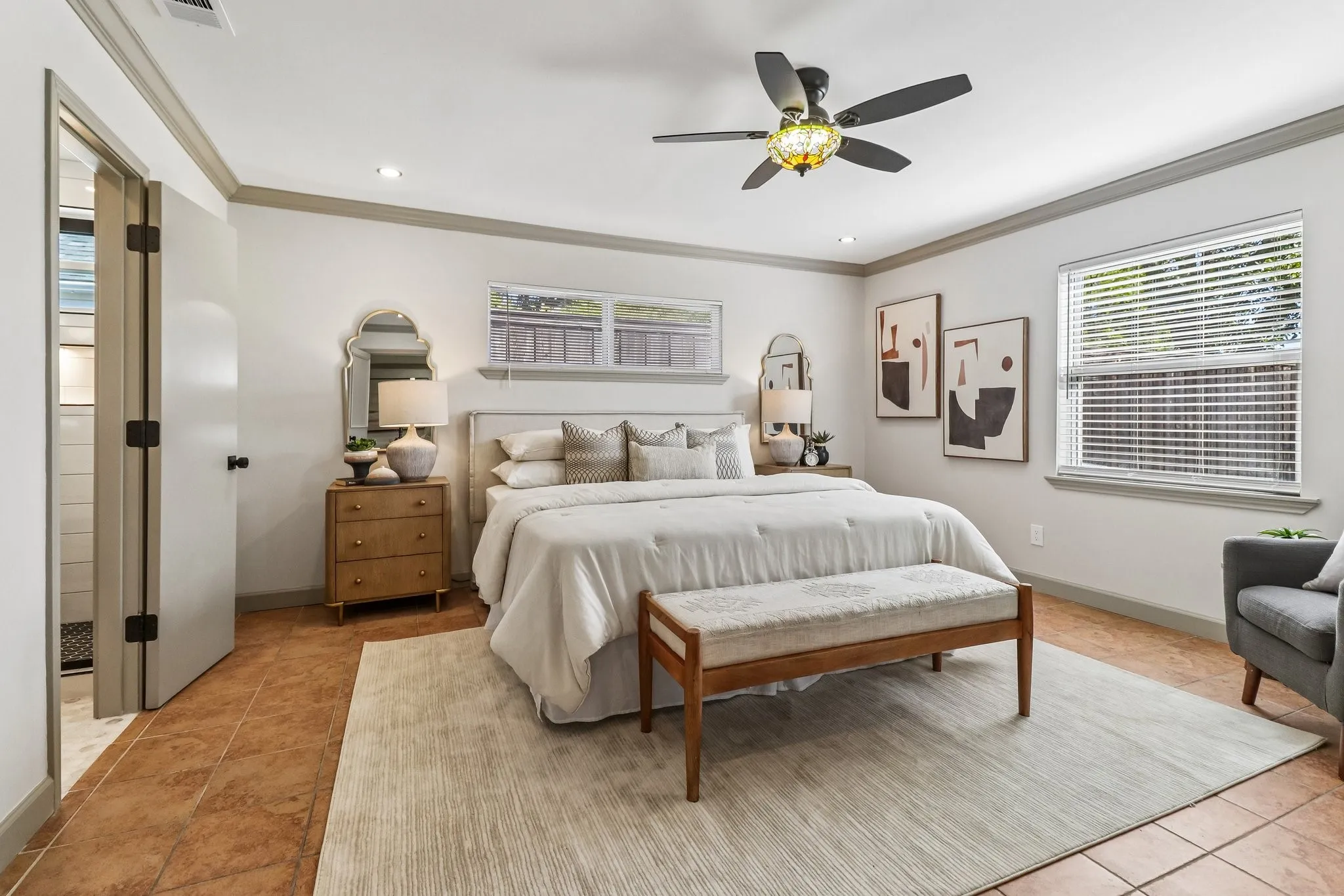 Recessed lighting, crown molding, and a ceiling fan with an ornamental light fixture