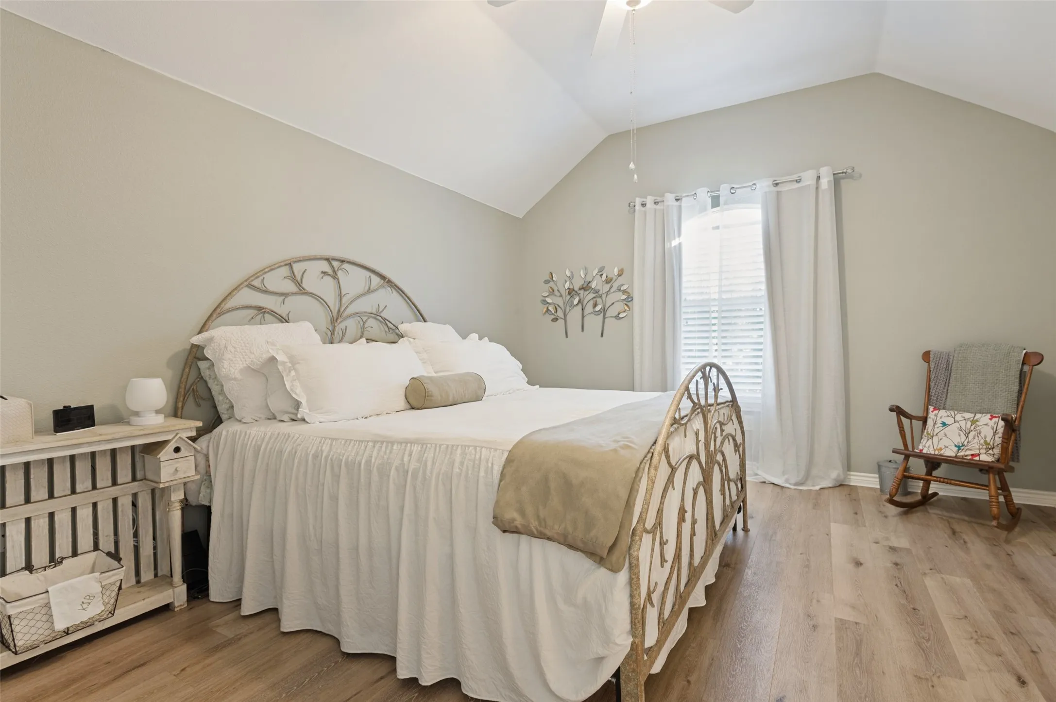 Primary bedroom with vaulted ceilings