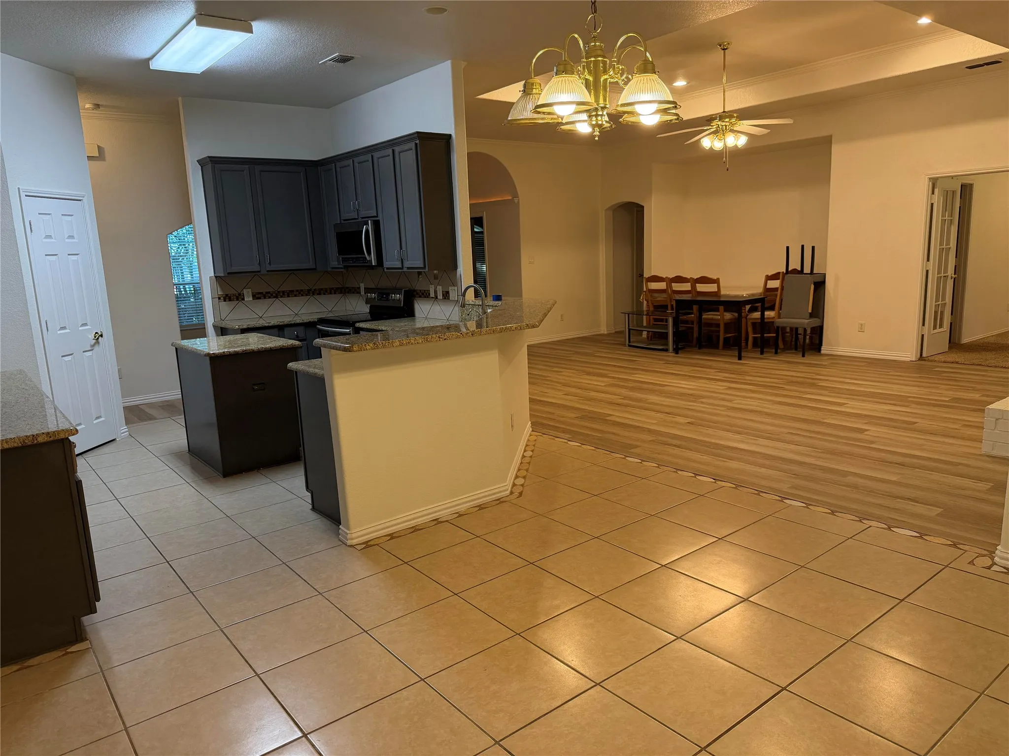 Beautiful Granite and backsplace with stainless steel appliances