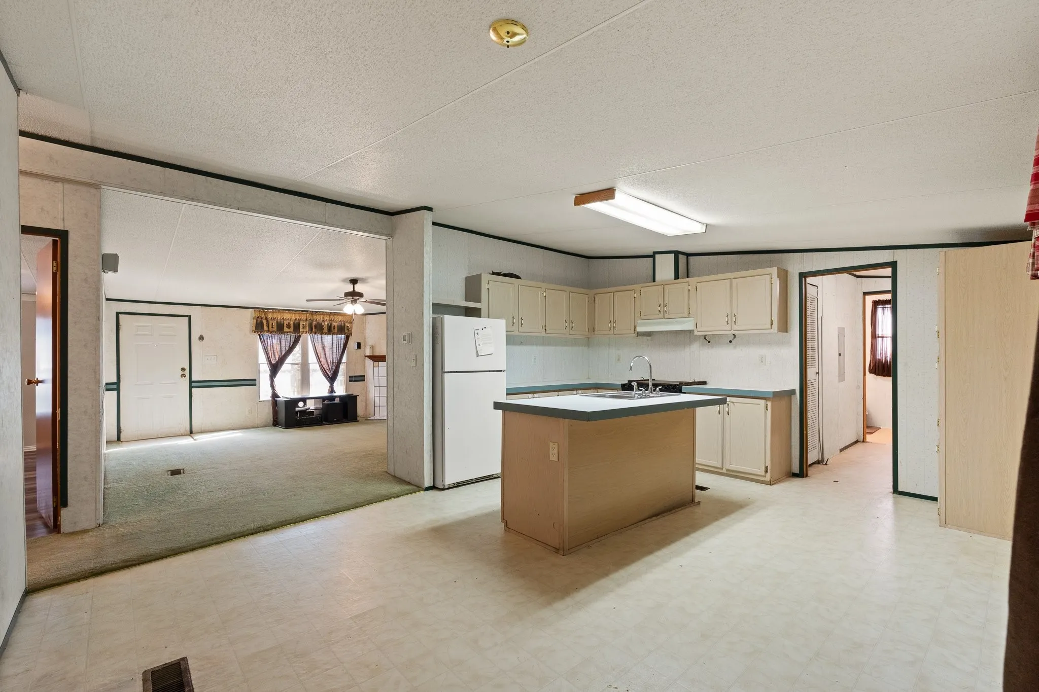 Kitchen open to living area, with eat in dining.