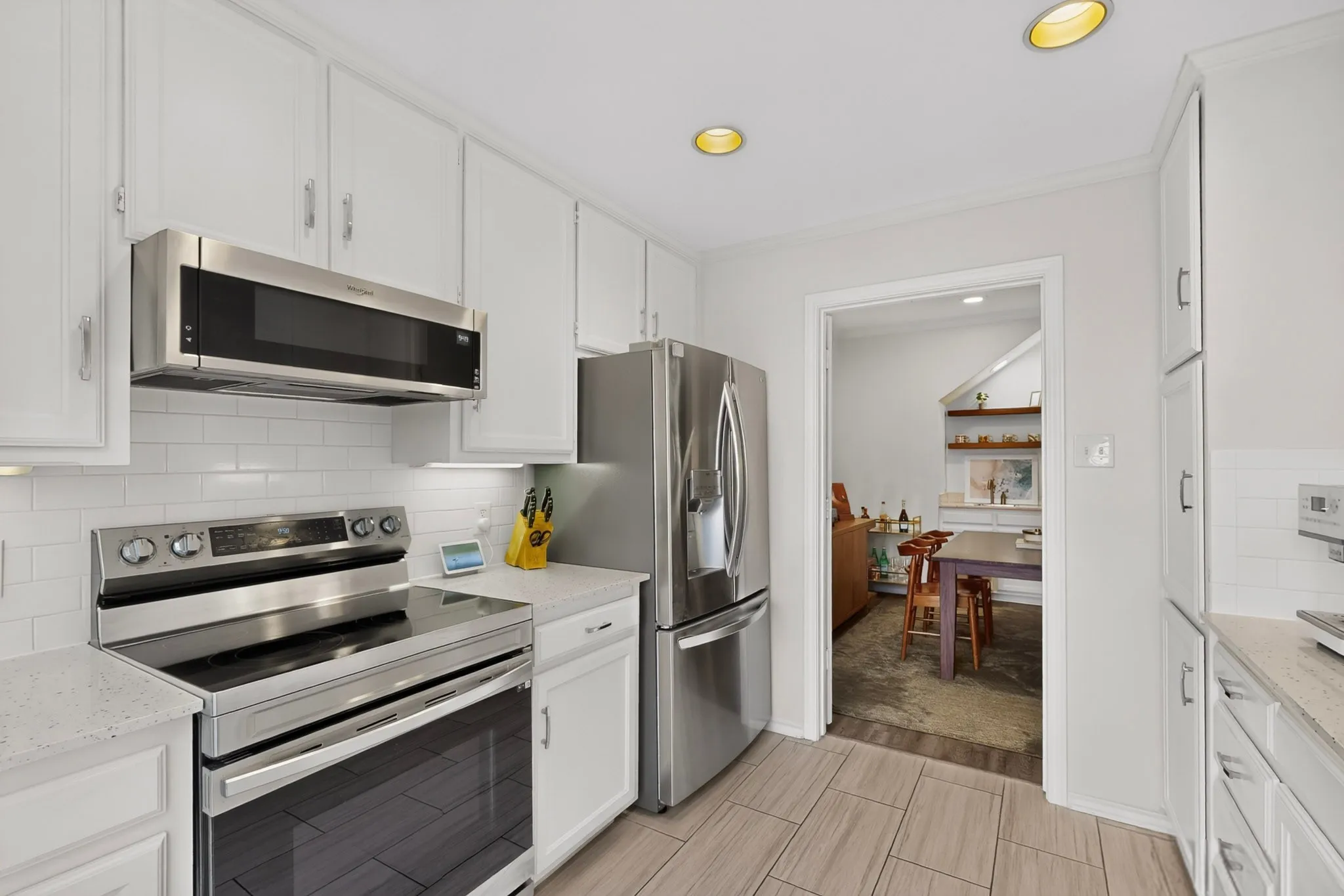 White cabinetry with brushed nickel hardware