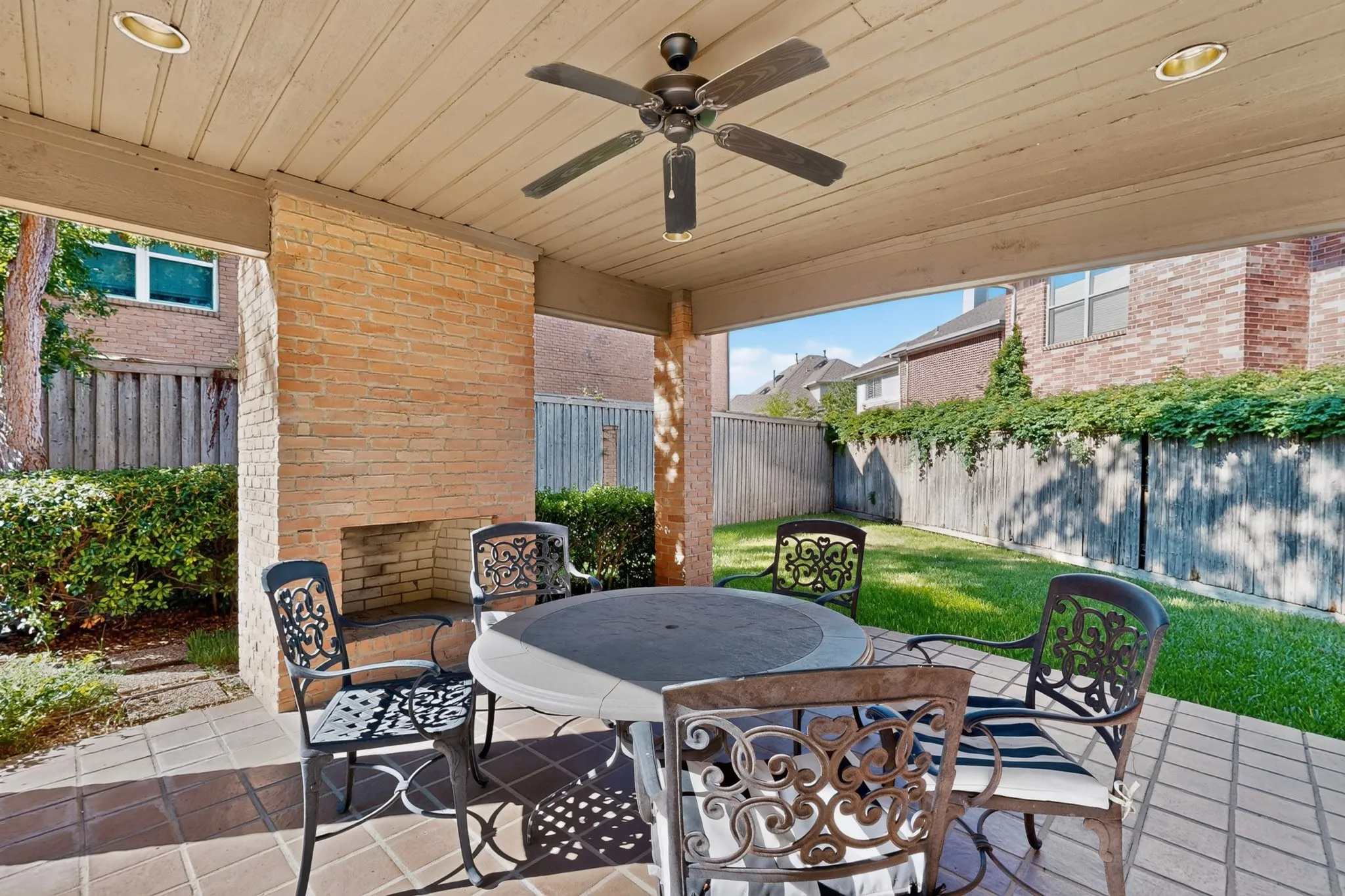 Community covered outdoor patio featuring brick flooring, recessed lighting, and an outdoor ceiling fan