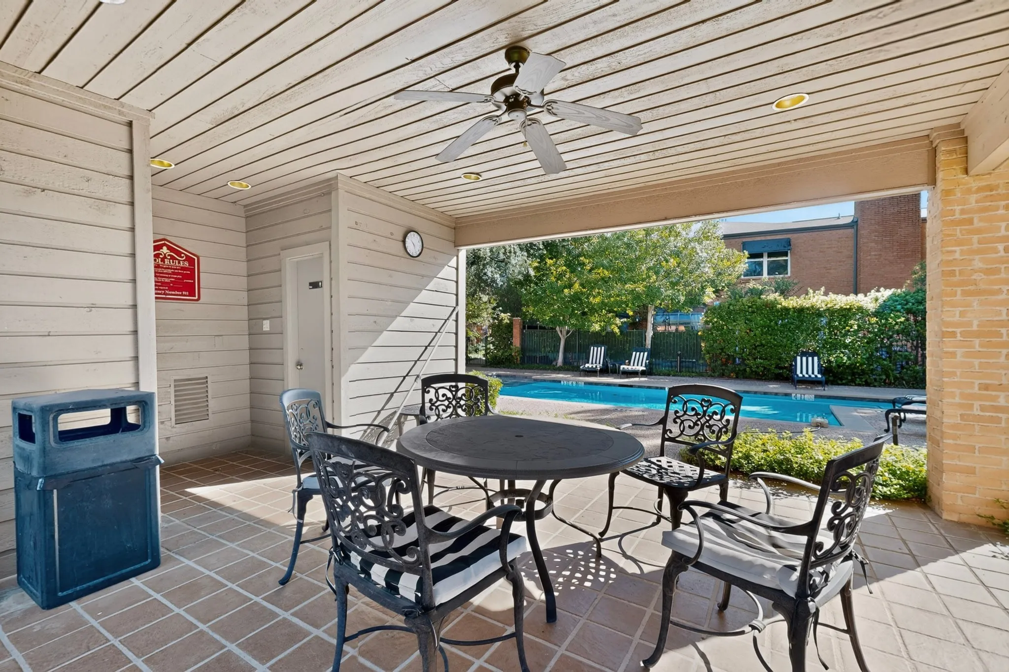 Community covered outdoor patio with a ceiling fan, recessed lighting, and tile flooring