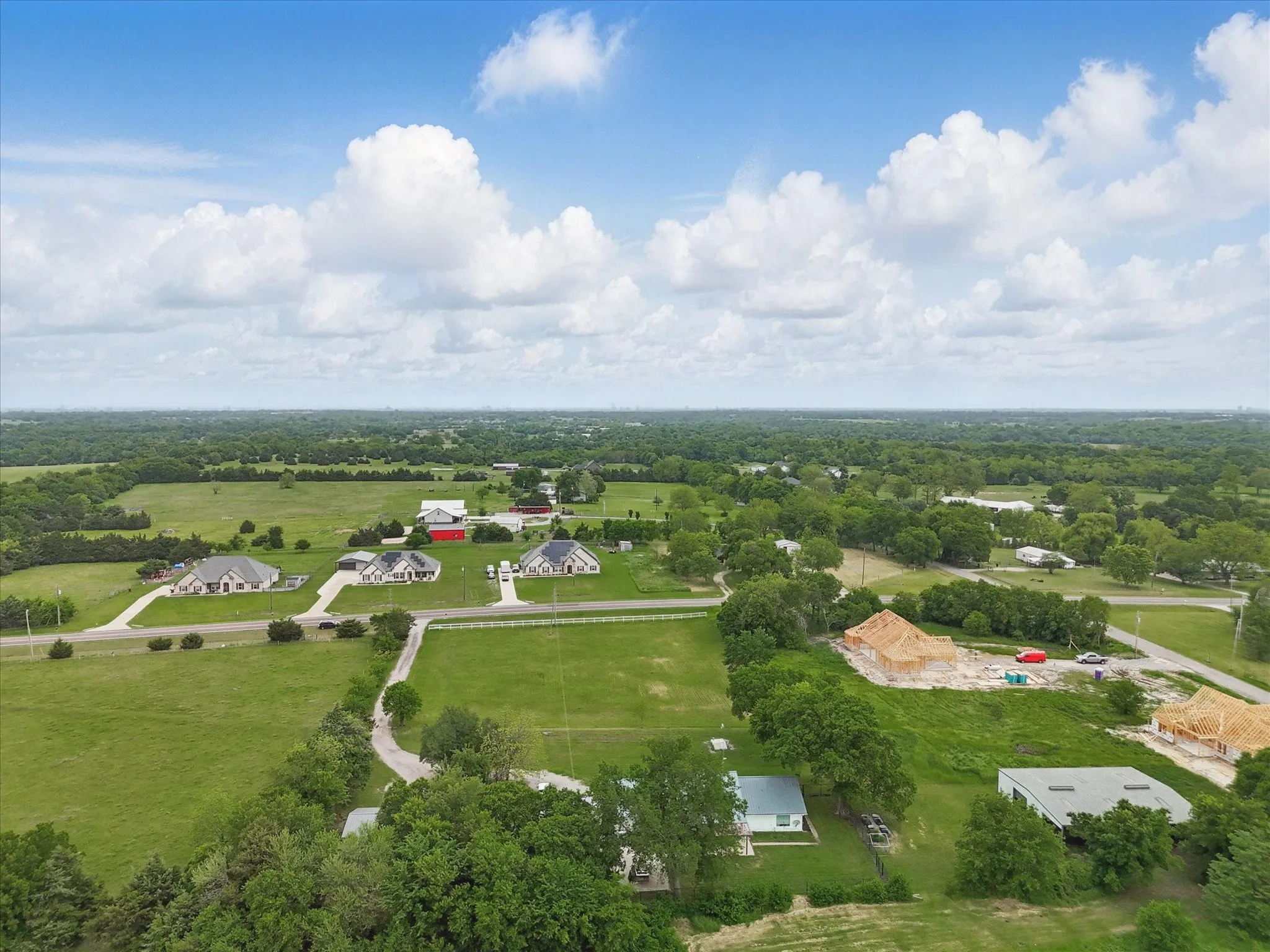 Expansive green landscape with scattered residential properties