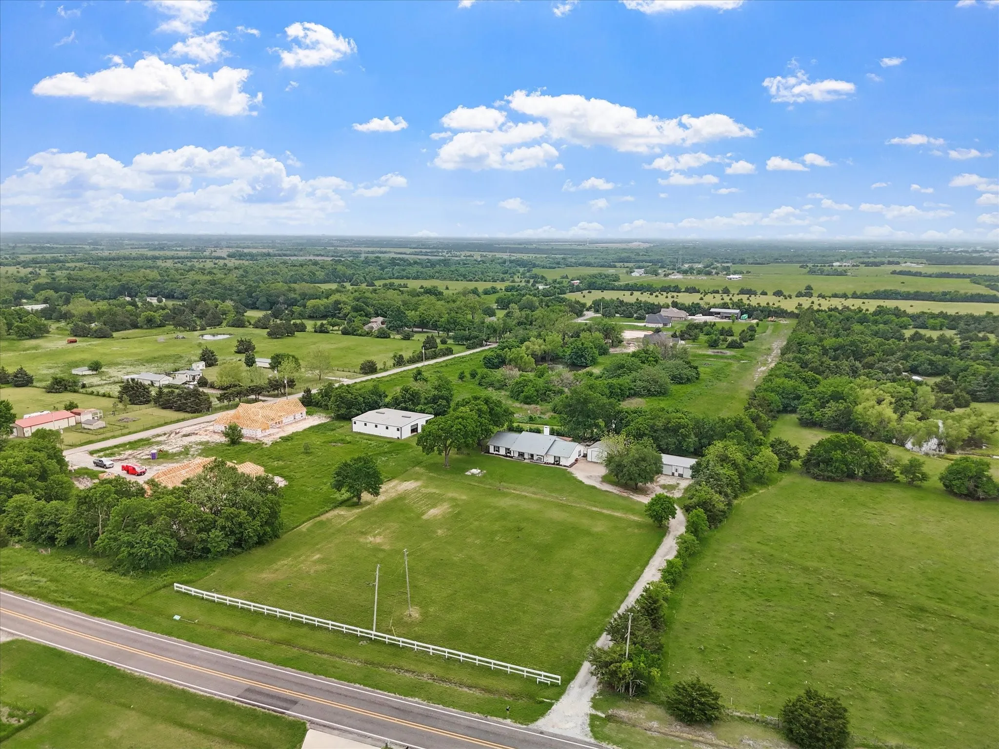 Expansive green acreage with diverse tree coverage