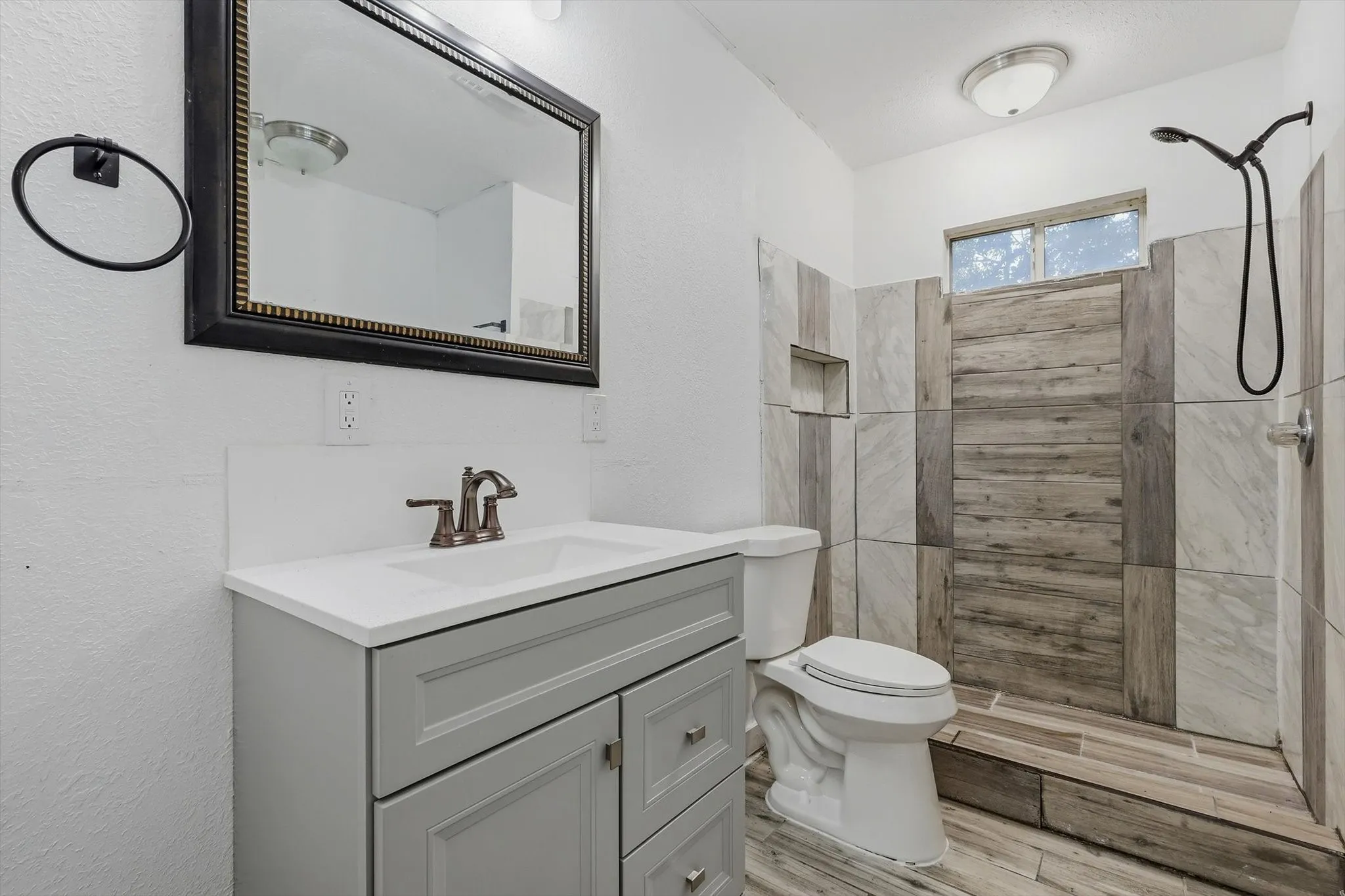 Modern vanity with a white countertop and integrated sink