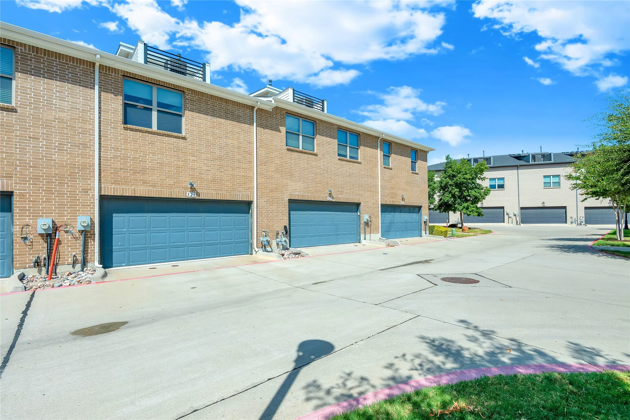 Brick exterior construction with multiple garage doors