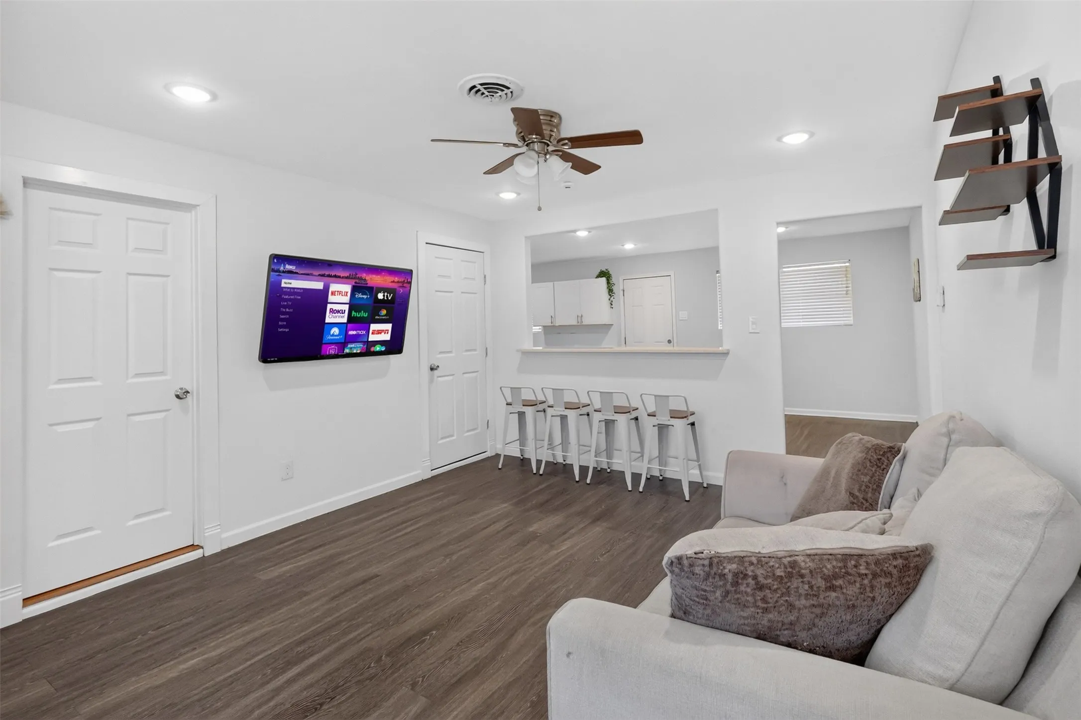 Updated living room with recessed lighting.