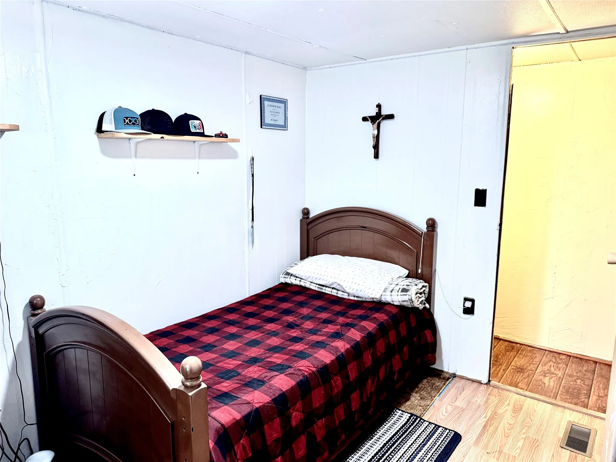 This bedroom has a large closet and a private sink
