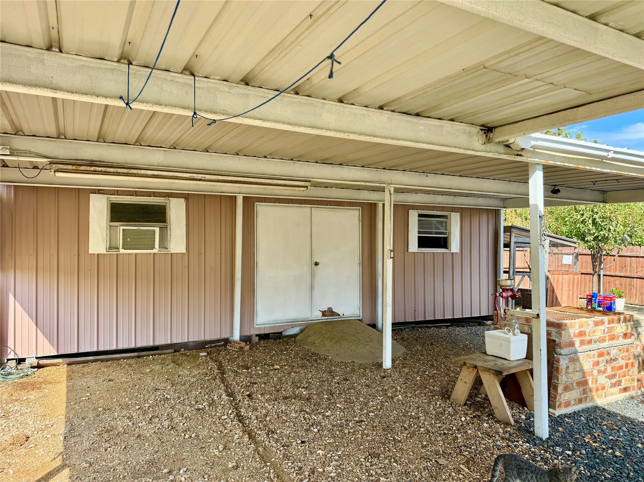 Outdoor building with electricity and plumbing.  Featrues a half bath