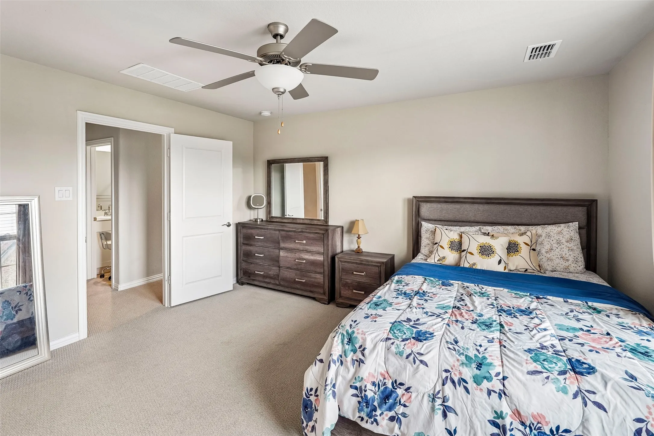 Recessed lighting, ceiling fan, and light-colored carpeting