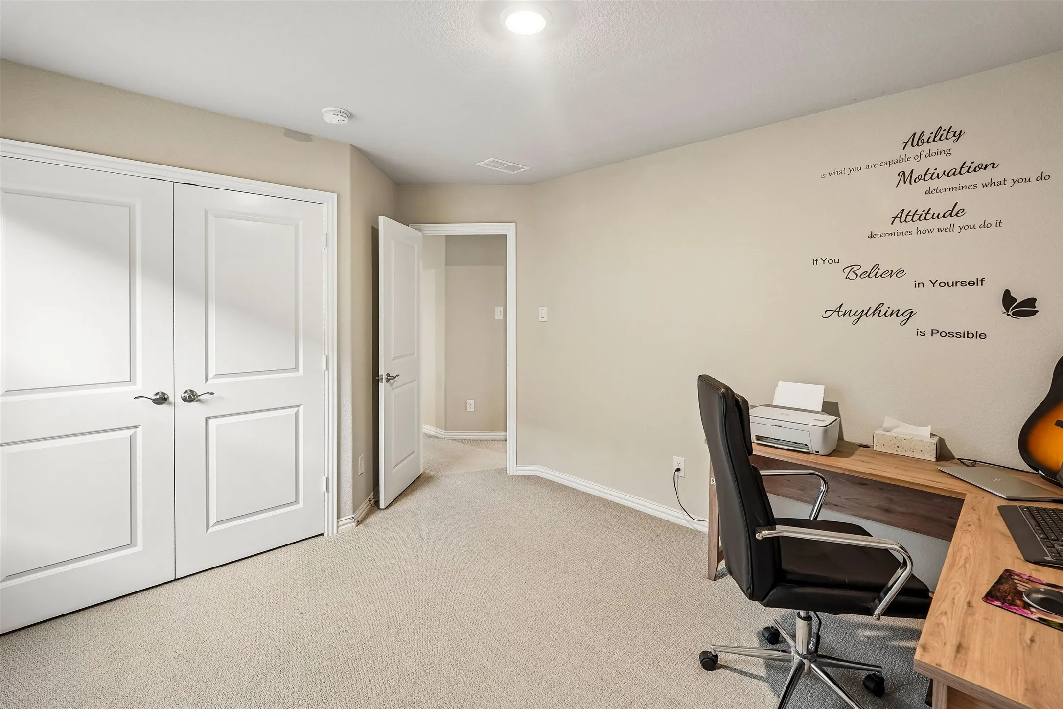 Wall-to-wall carpeting and neutral wall tones