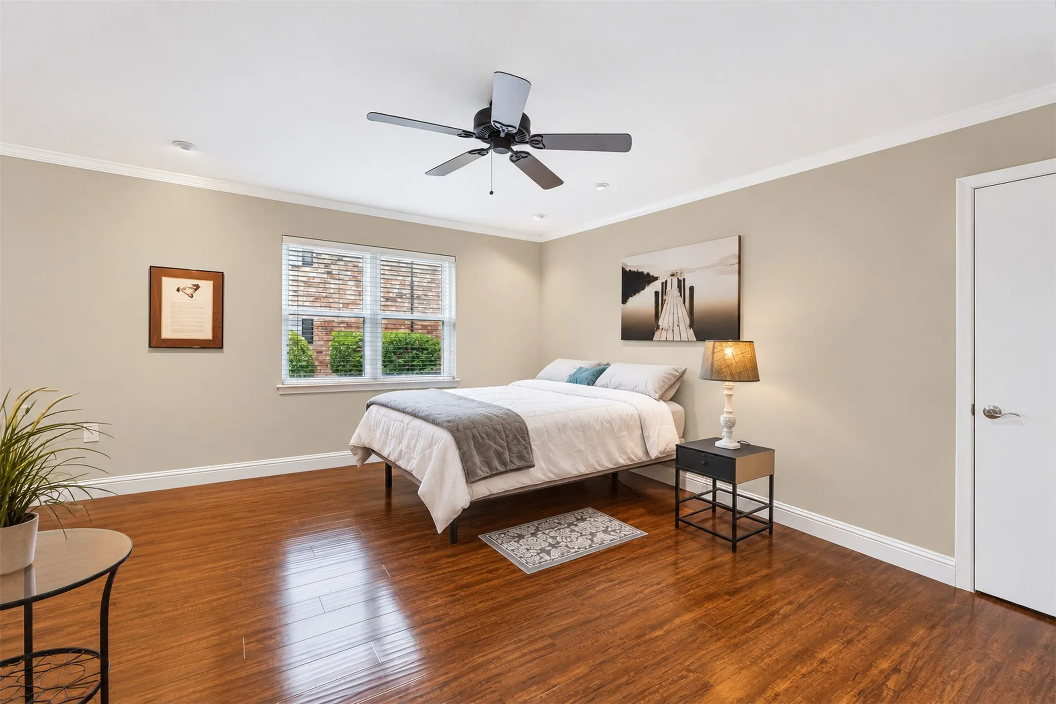 Hardwood-style flooring throughout with crown molding