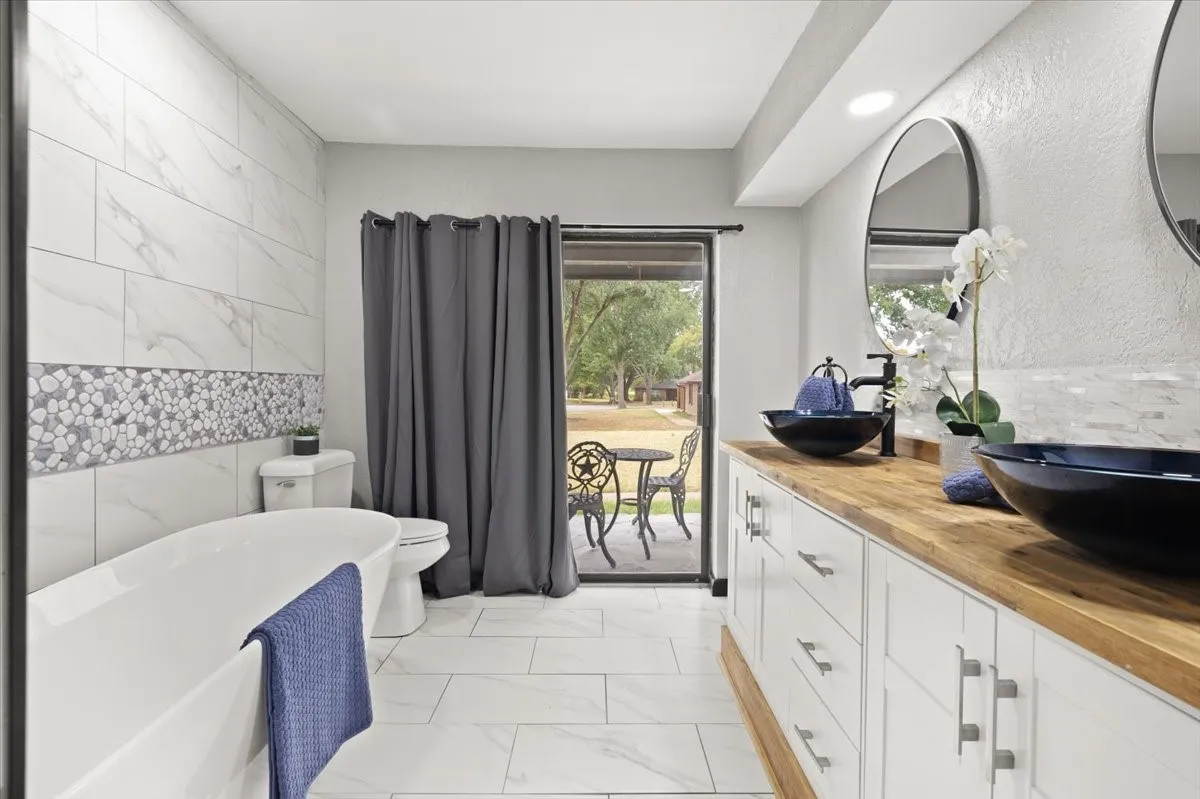 Primary Bathroom with stand alone tub, dual vanity