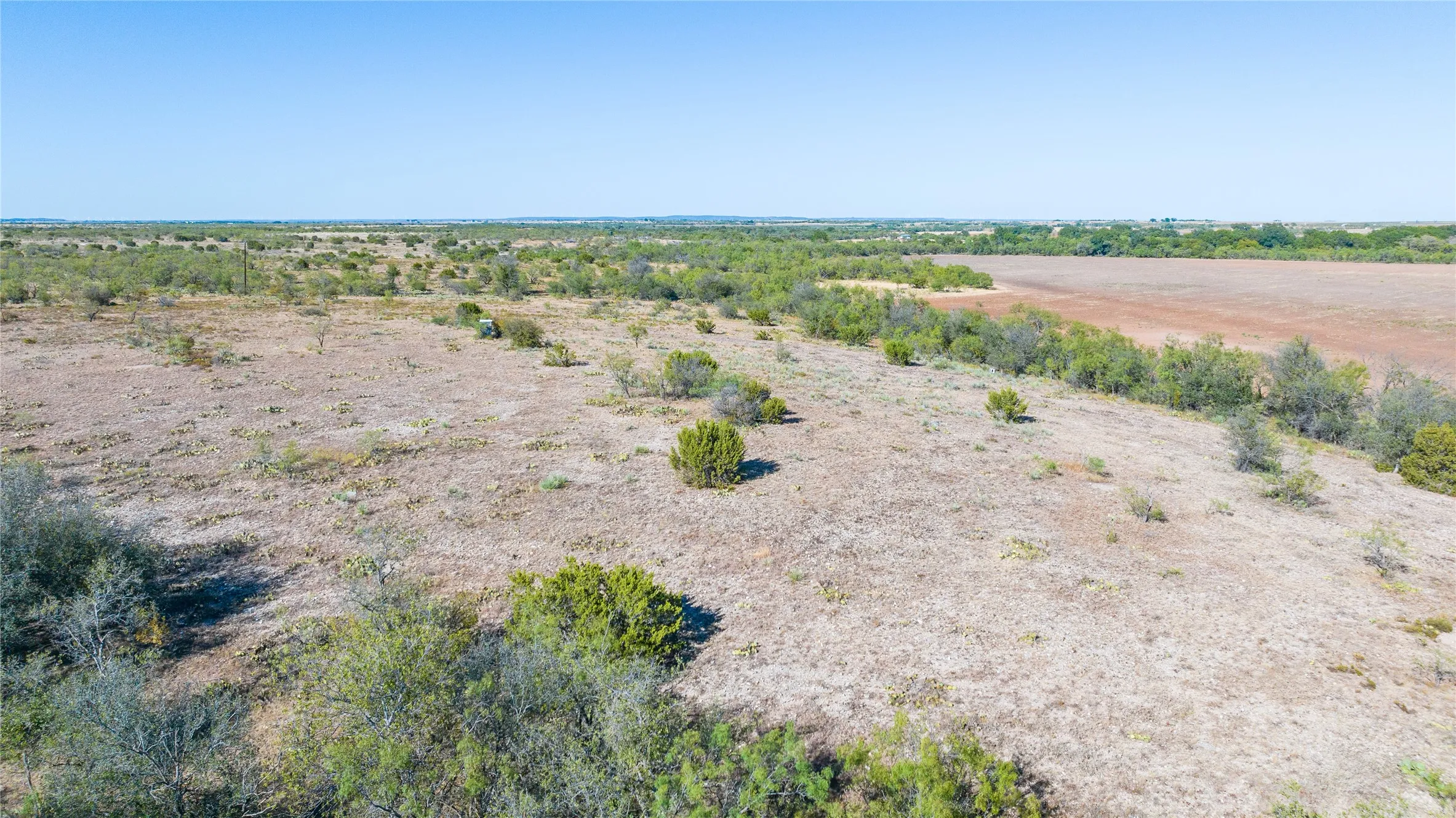 Expansive acreage featuring natural vegetation and open land