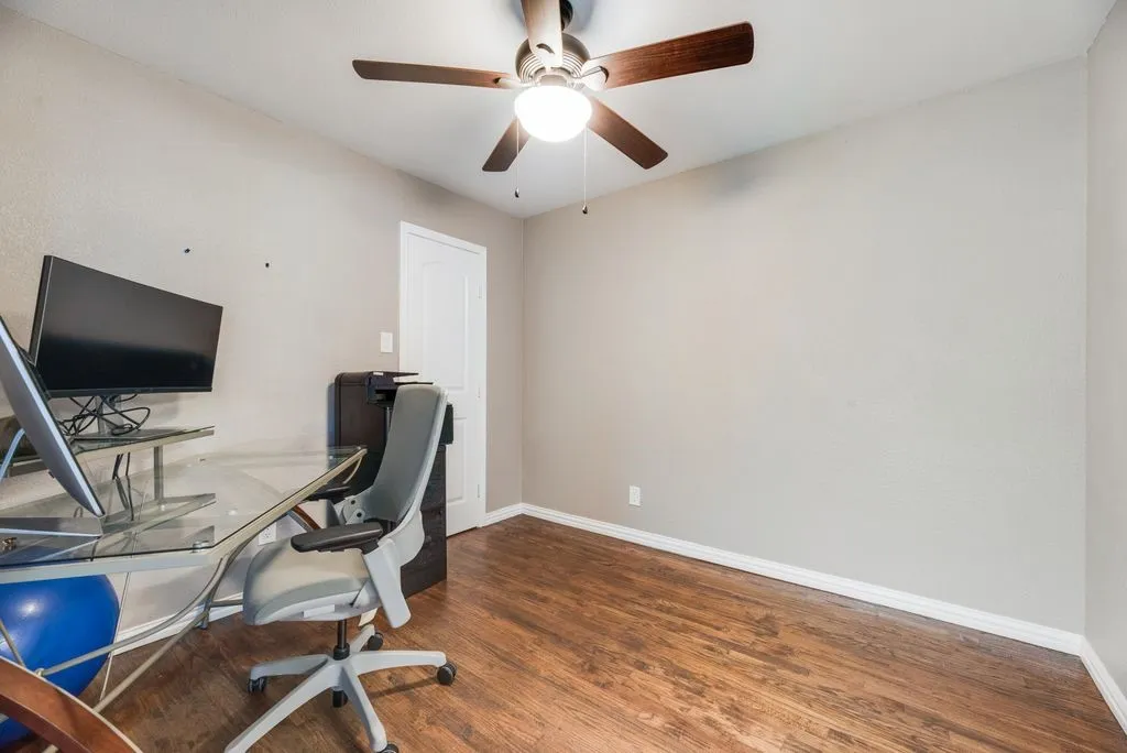 Bedroom 3-  Wood-finish flooring, ceiling fan with integrated lighting, and a paneled interior door