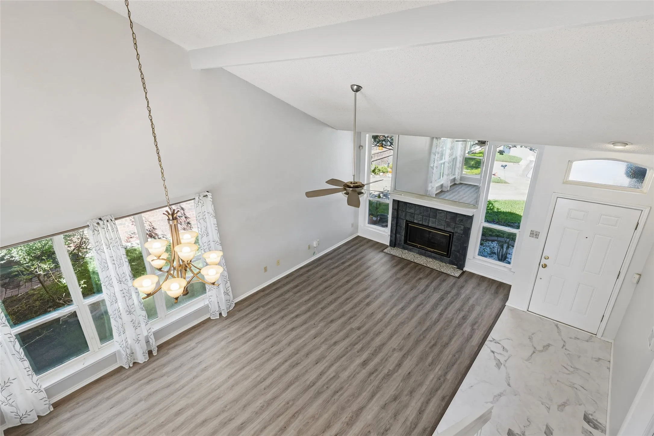 Stunning view from the loft area showcasing the openness of the living / dining areas.