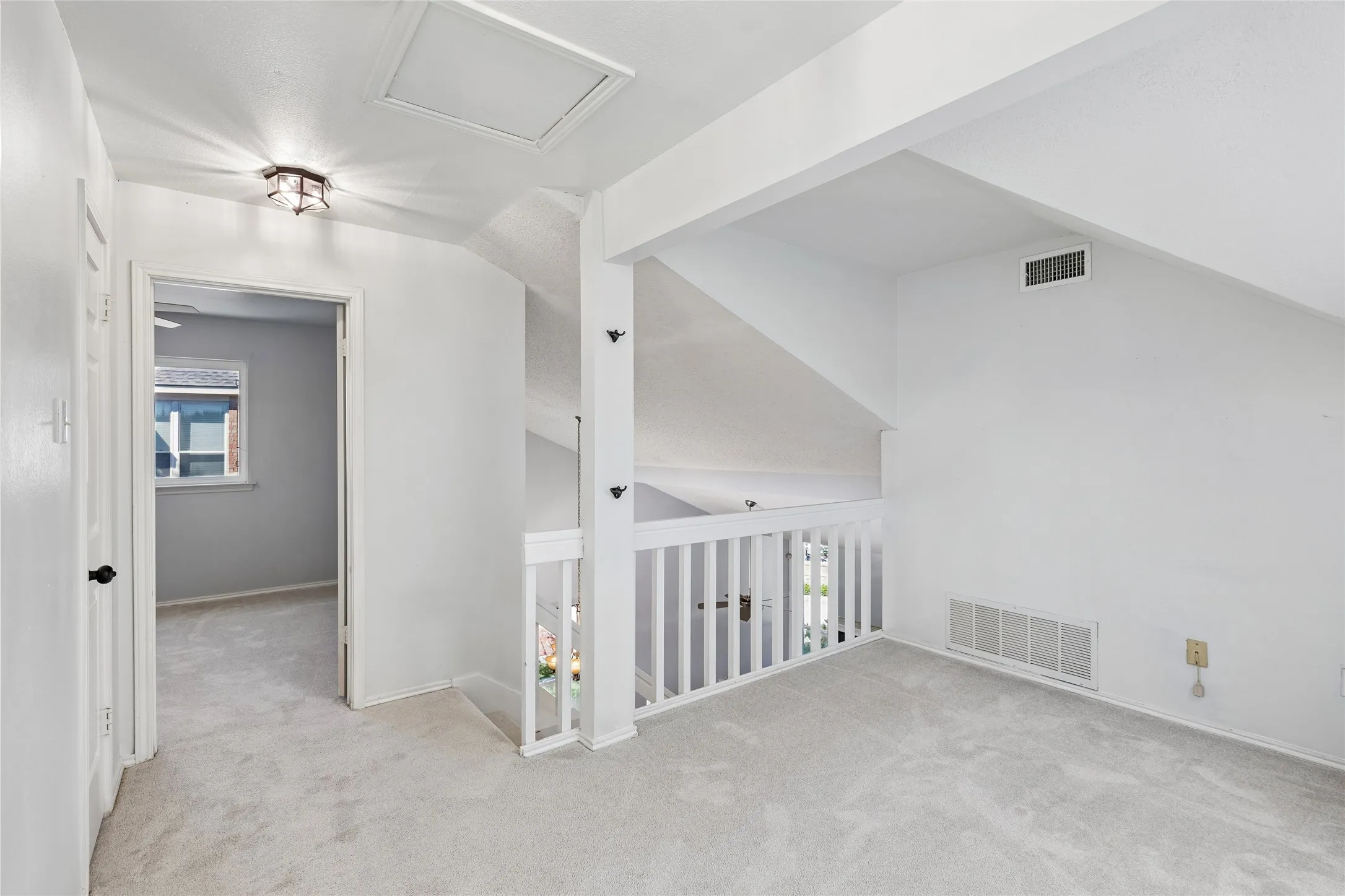 Ascend the stairs to the second floor which offers a versatile loft and 2 split bedrooms with comfortable carpeting and shared full bath with a combination tub/shower and tile floor.