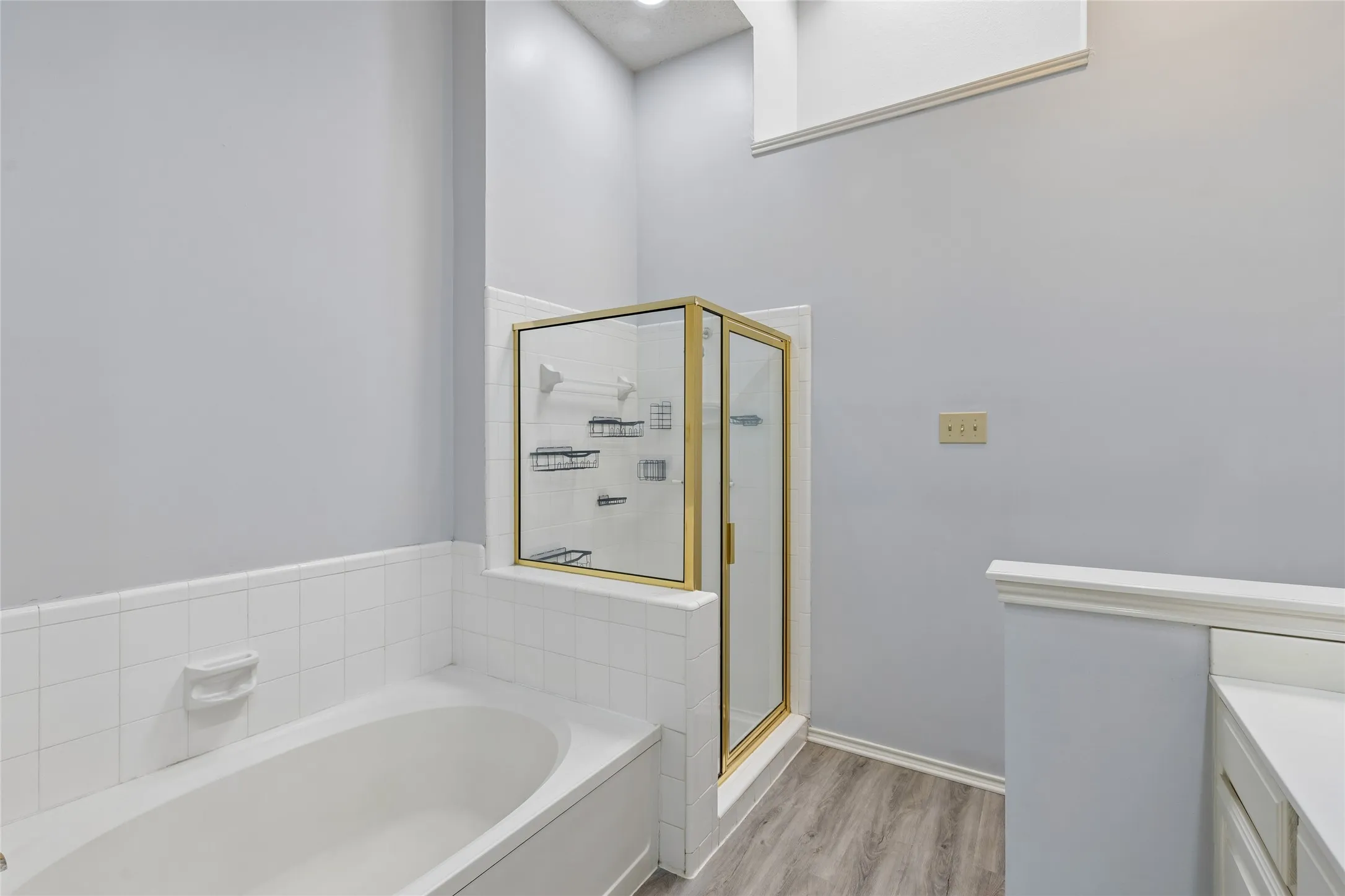 A garden tub is perfect for relaxing and a separate shower awaits.