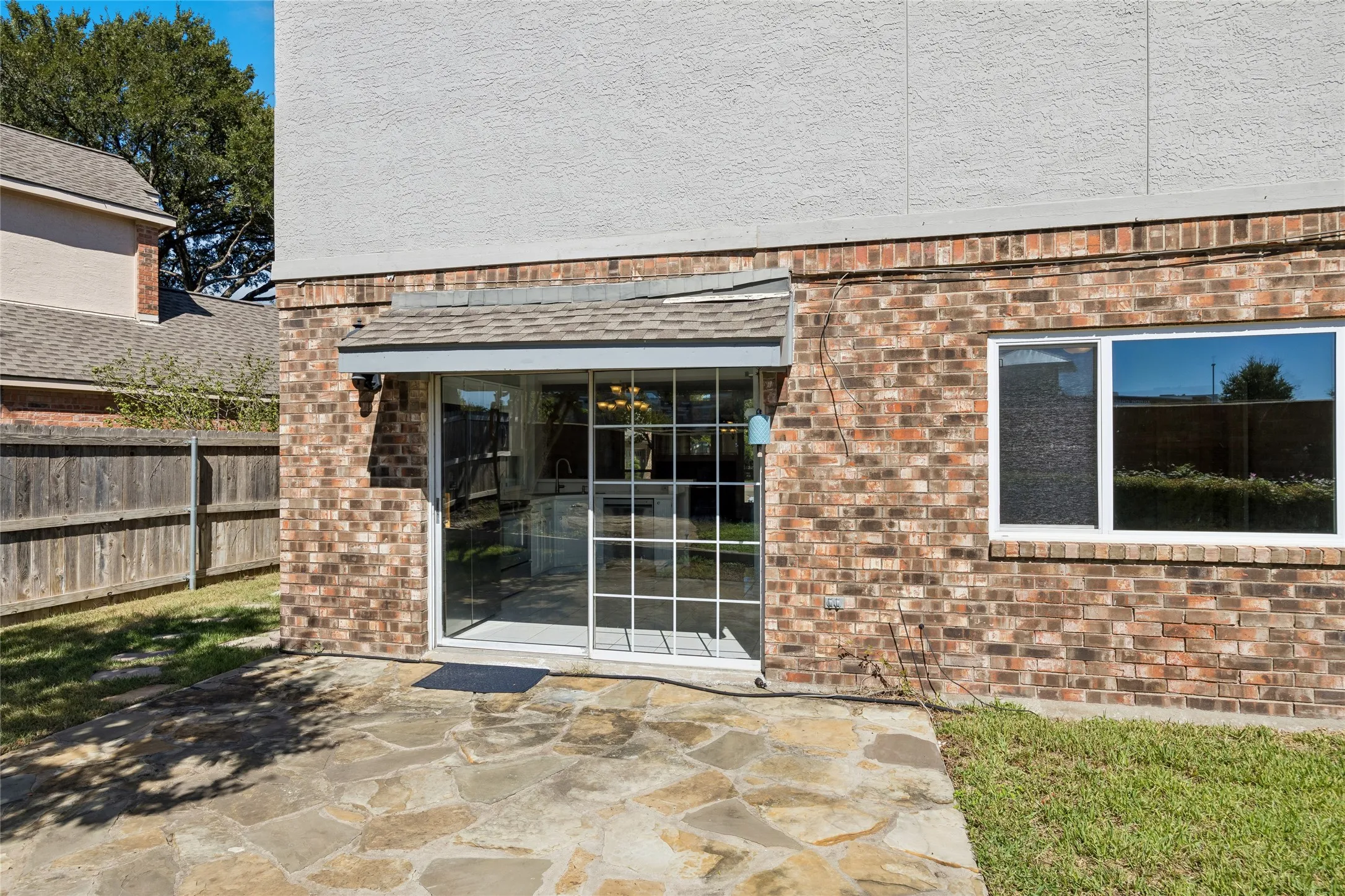 The patio provides easy acess into the kitchen or side yard to a gate giving easy access to front yard.