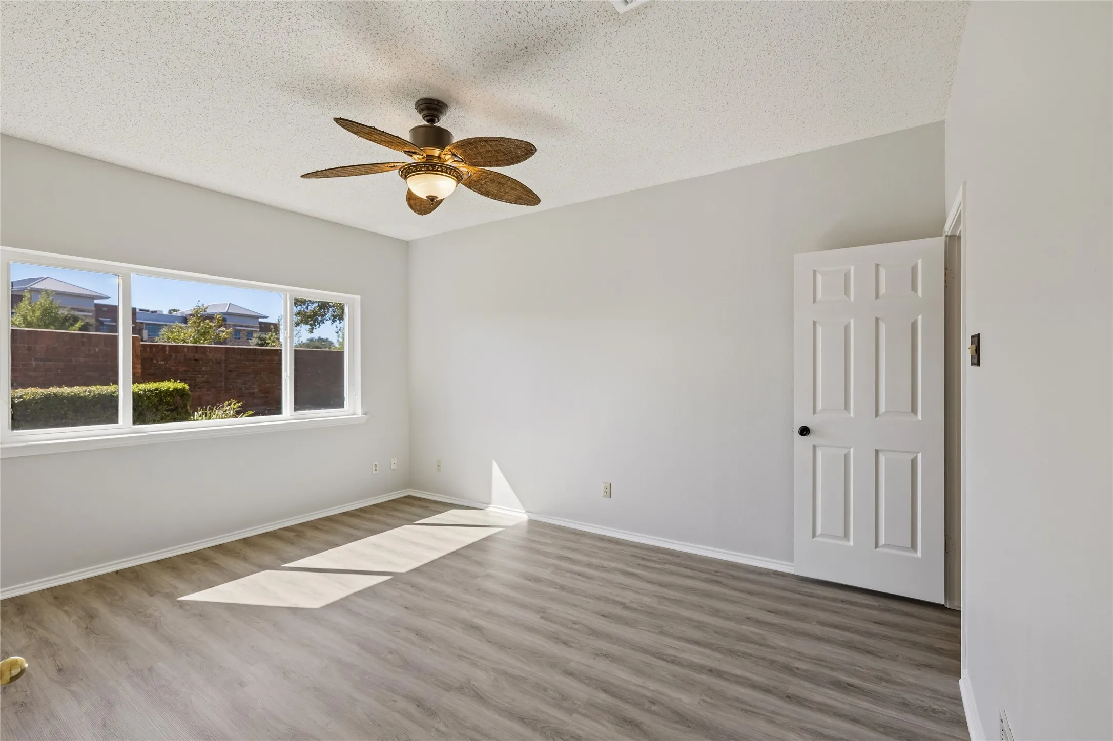 Light and bright primary bedroom also features easy-care luxury vinyl flooring throughout.