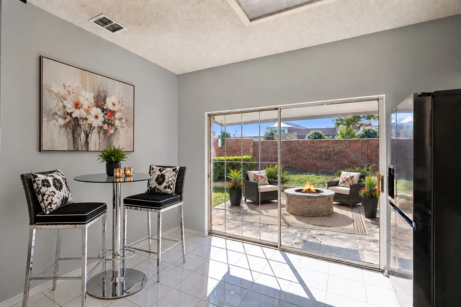 Virtually staged eat-in kitchen flows to the patio with 2 entertaining areas.