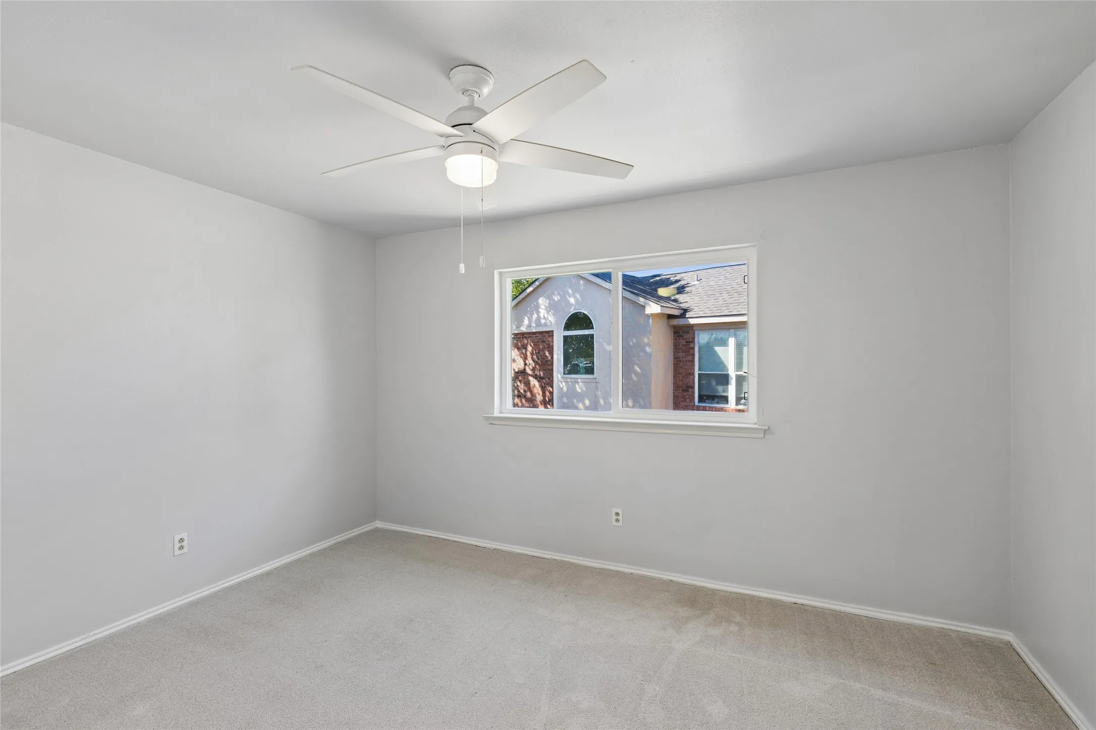 Bedroom 2 features bright natural light and closet.