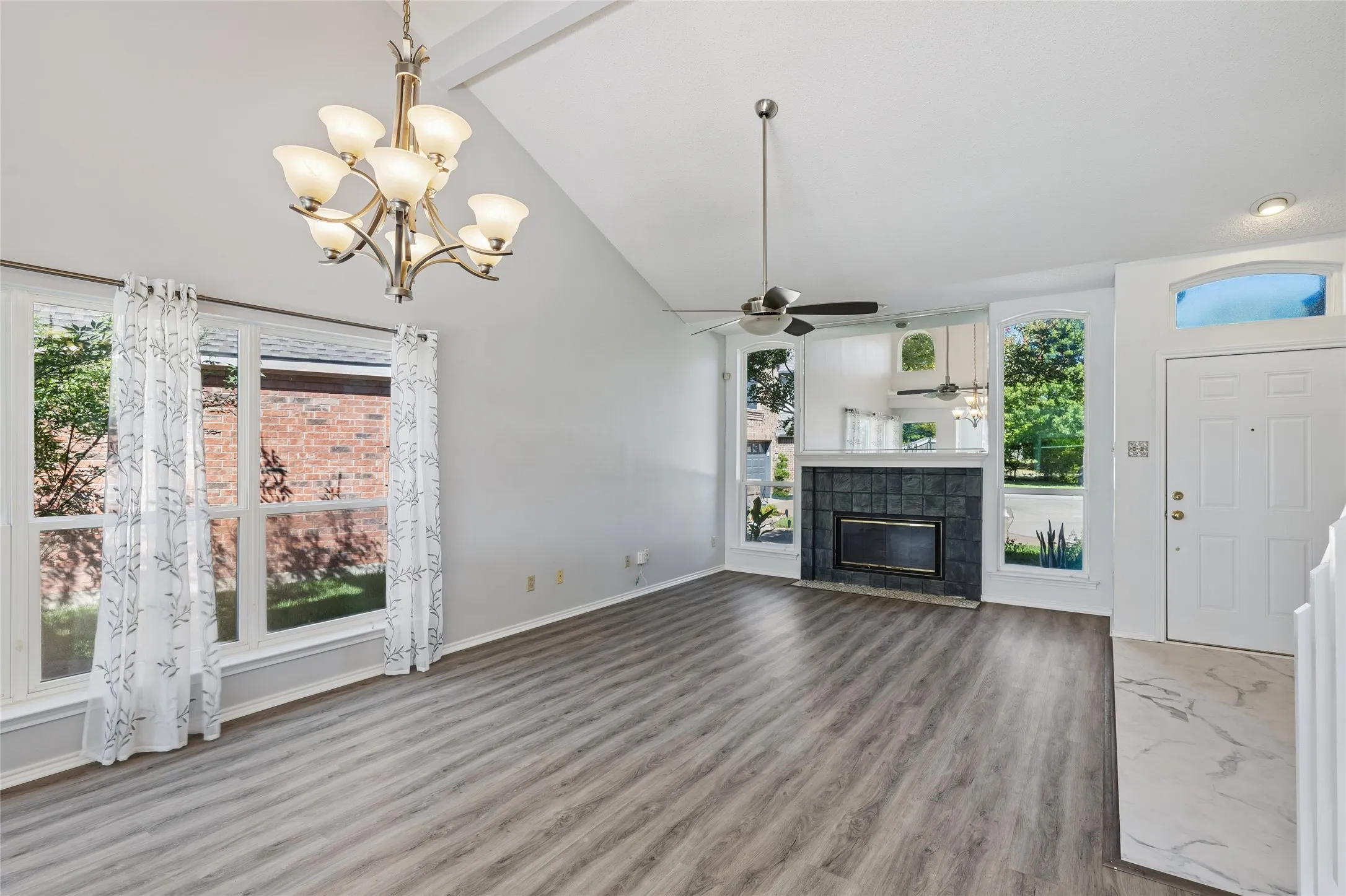 The bright and cheery dining area flows seamlessly into living area and features windows affording abundant light.