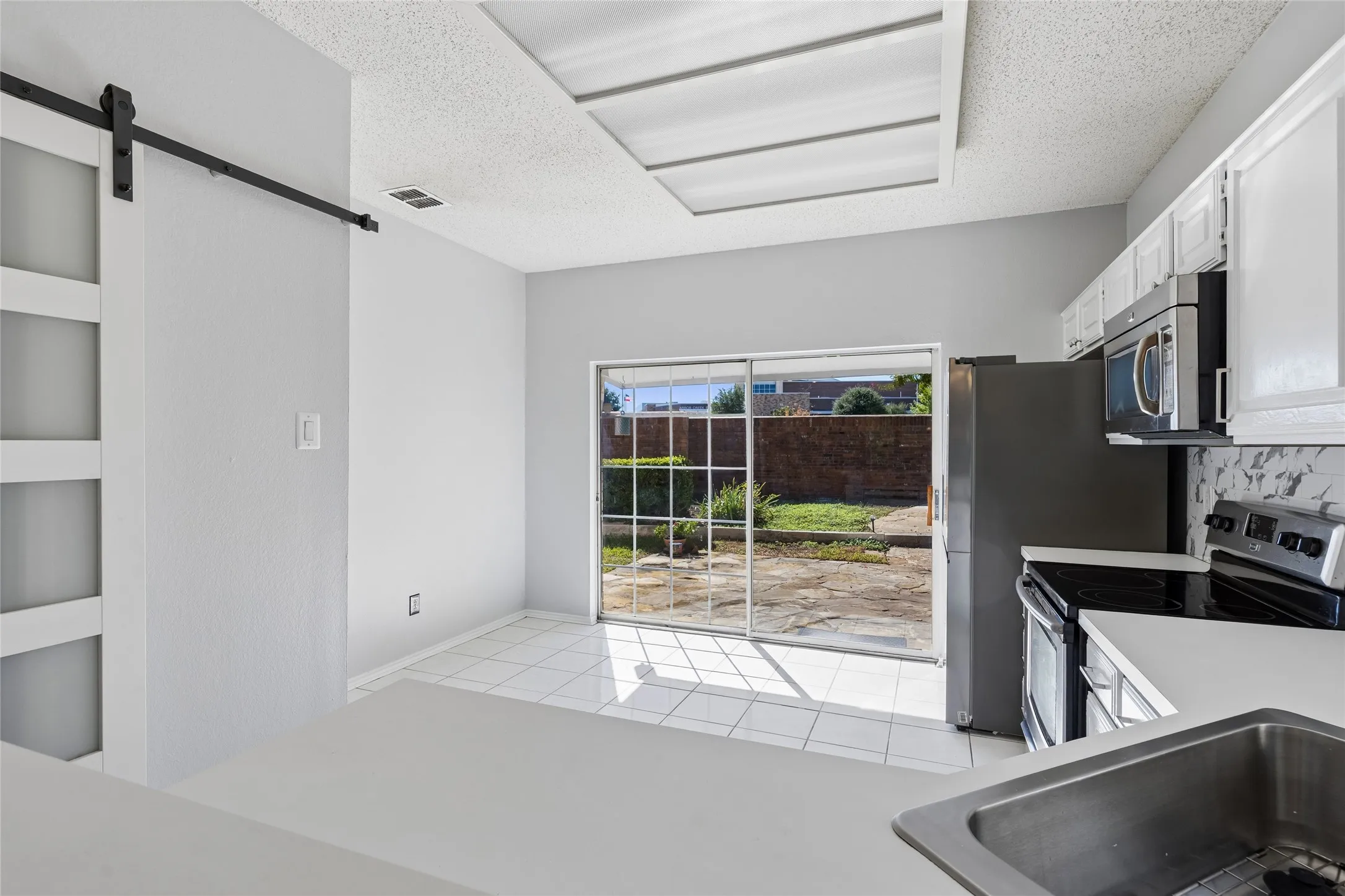 The eat-in kitchen offers relaxing views of the patio area.