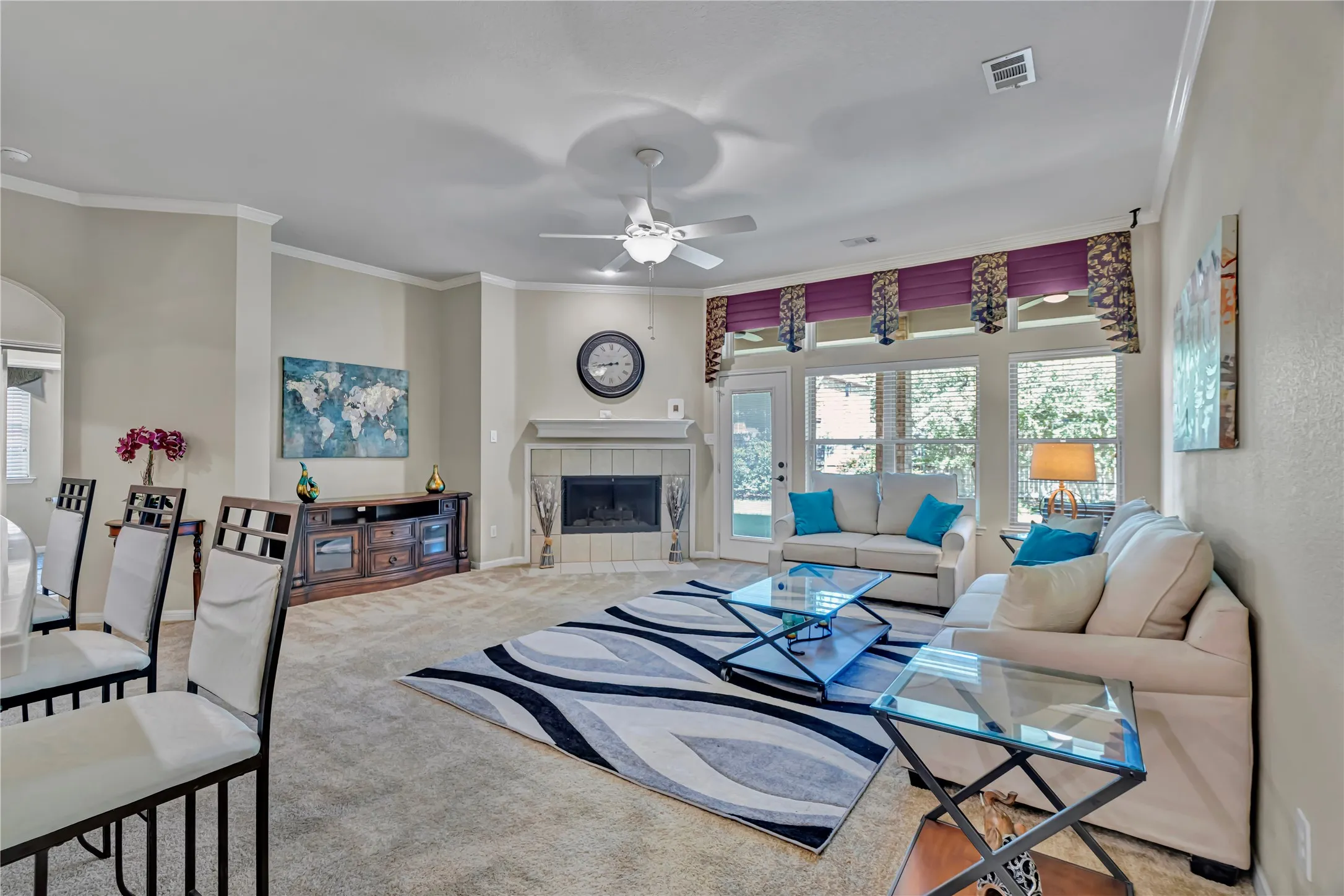 Large spacious living room with gas fireplace and wall of windows!