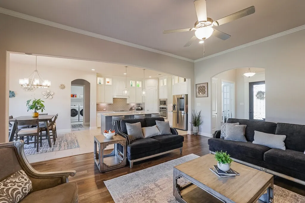 Hardwood-finish flooring, recessed lighting, ceiling fan, arched doorway, and built-in stainless steel appliances