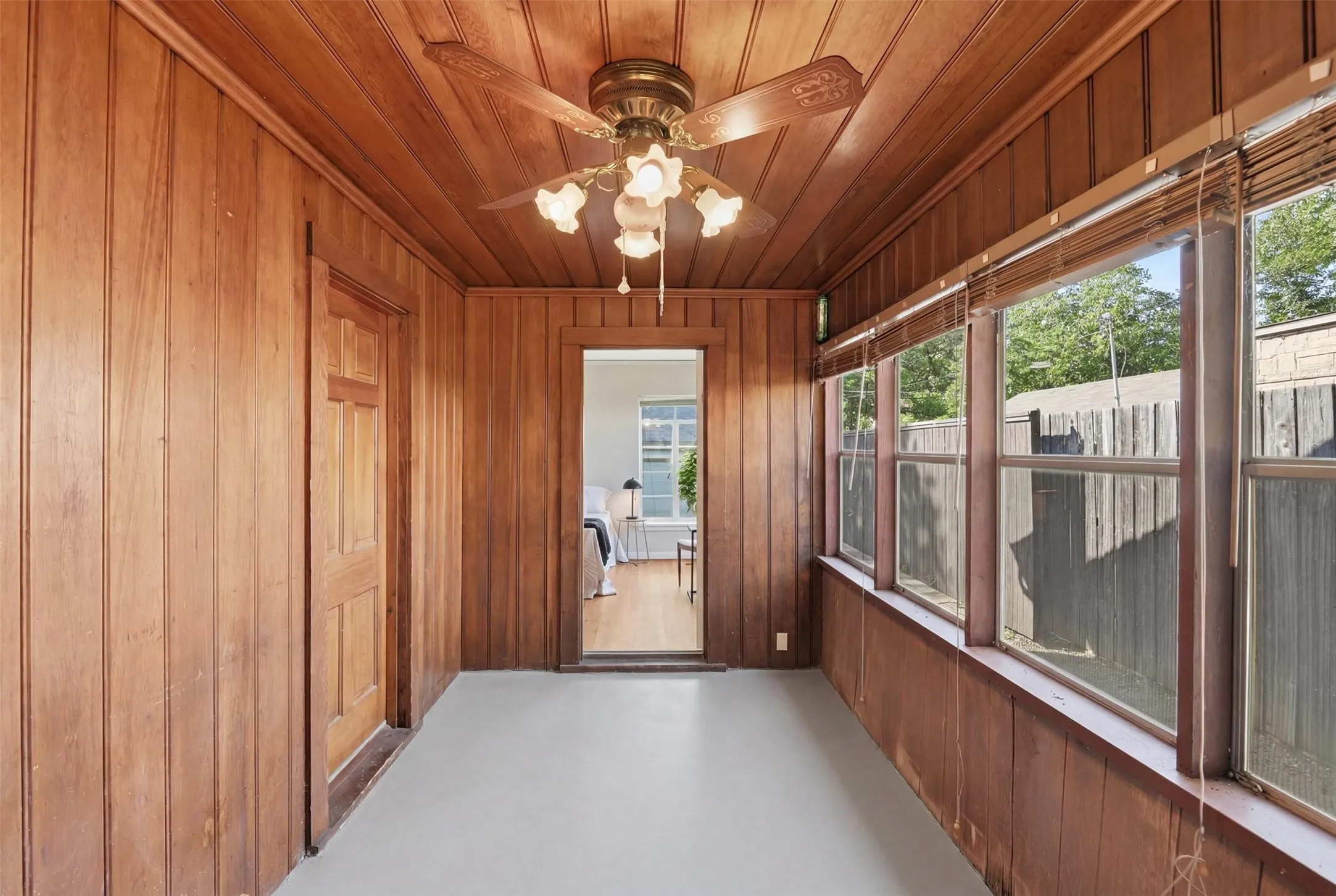 Enclosed side porch, looking back towards the primary bedroom, where the envisioned ensuite bath would be.
