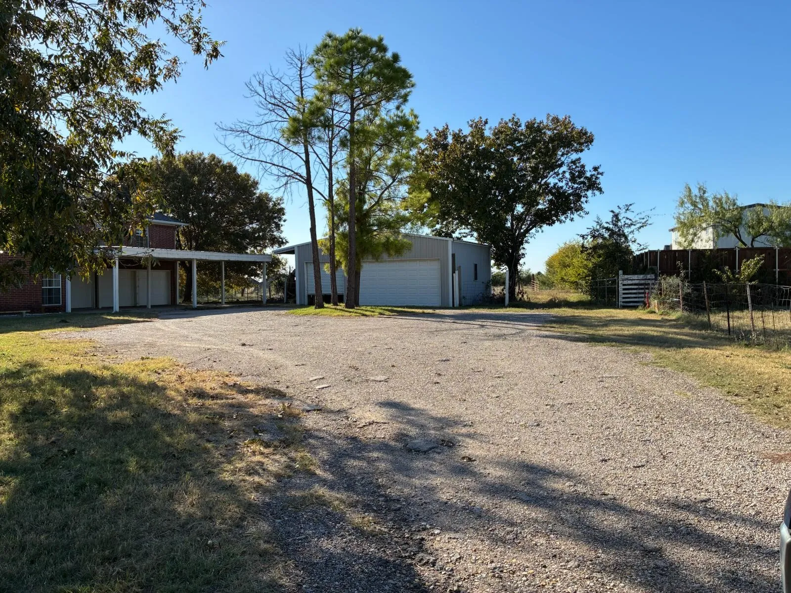 View of front of house with an outbuilding and a detached garage