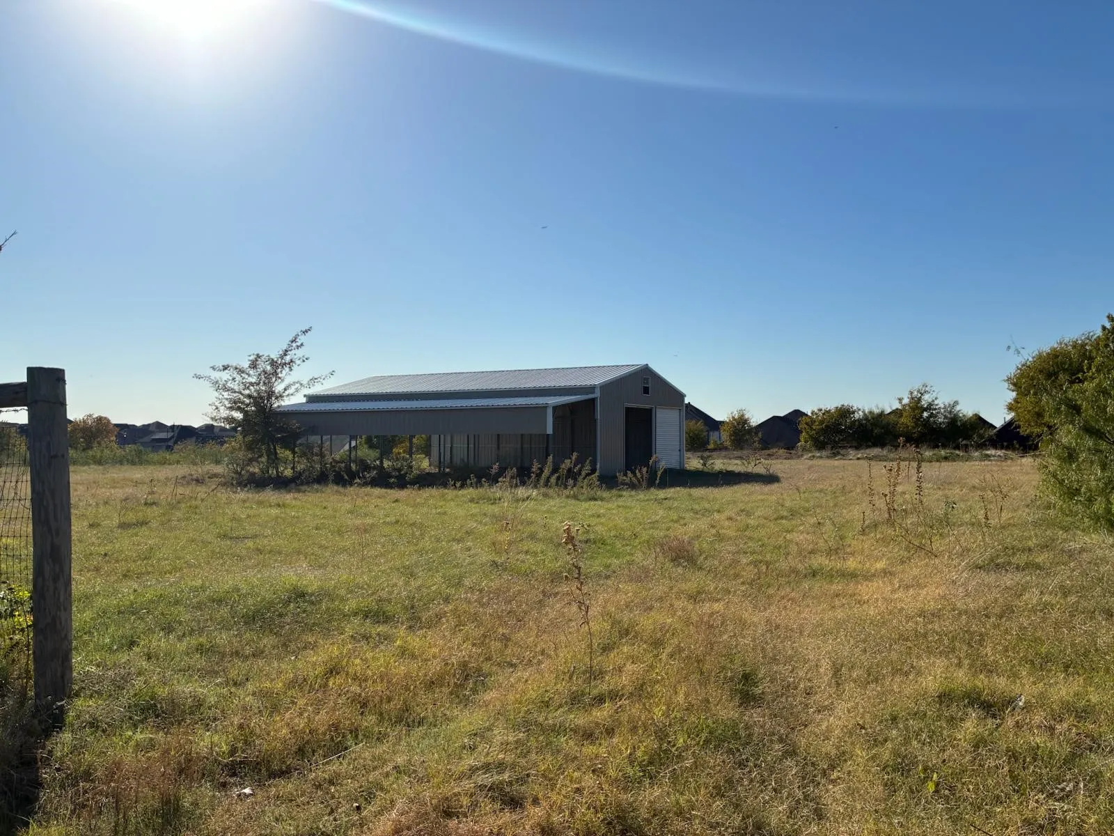 View of yard featuring an outbuilding and a rural view