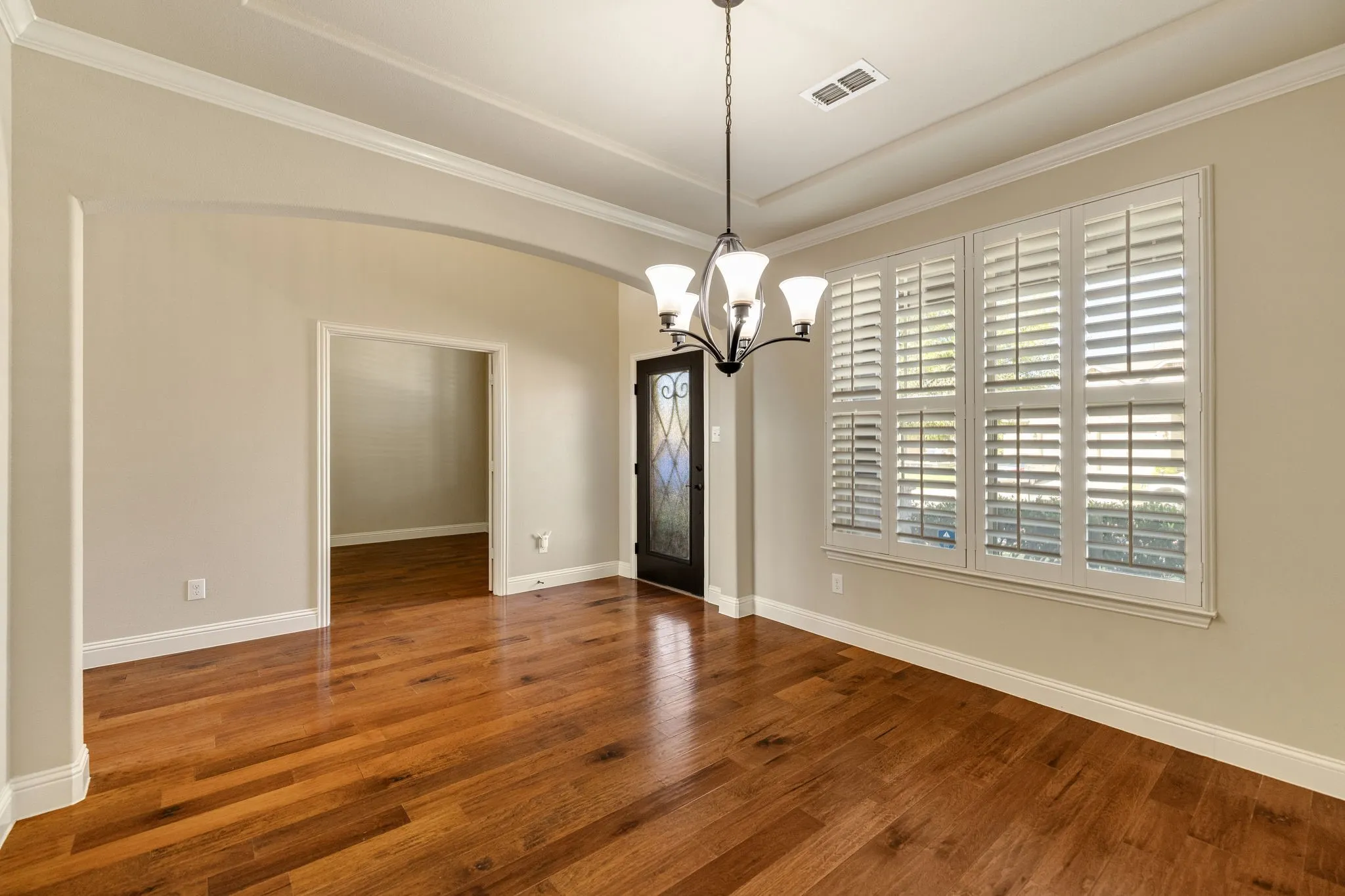 View from formal dining to entry, study.