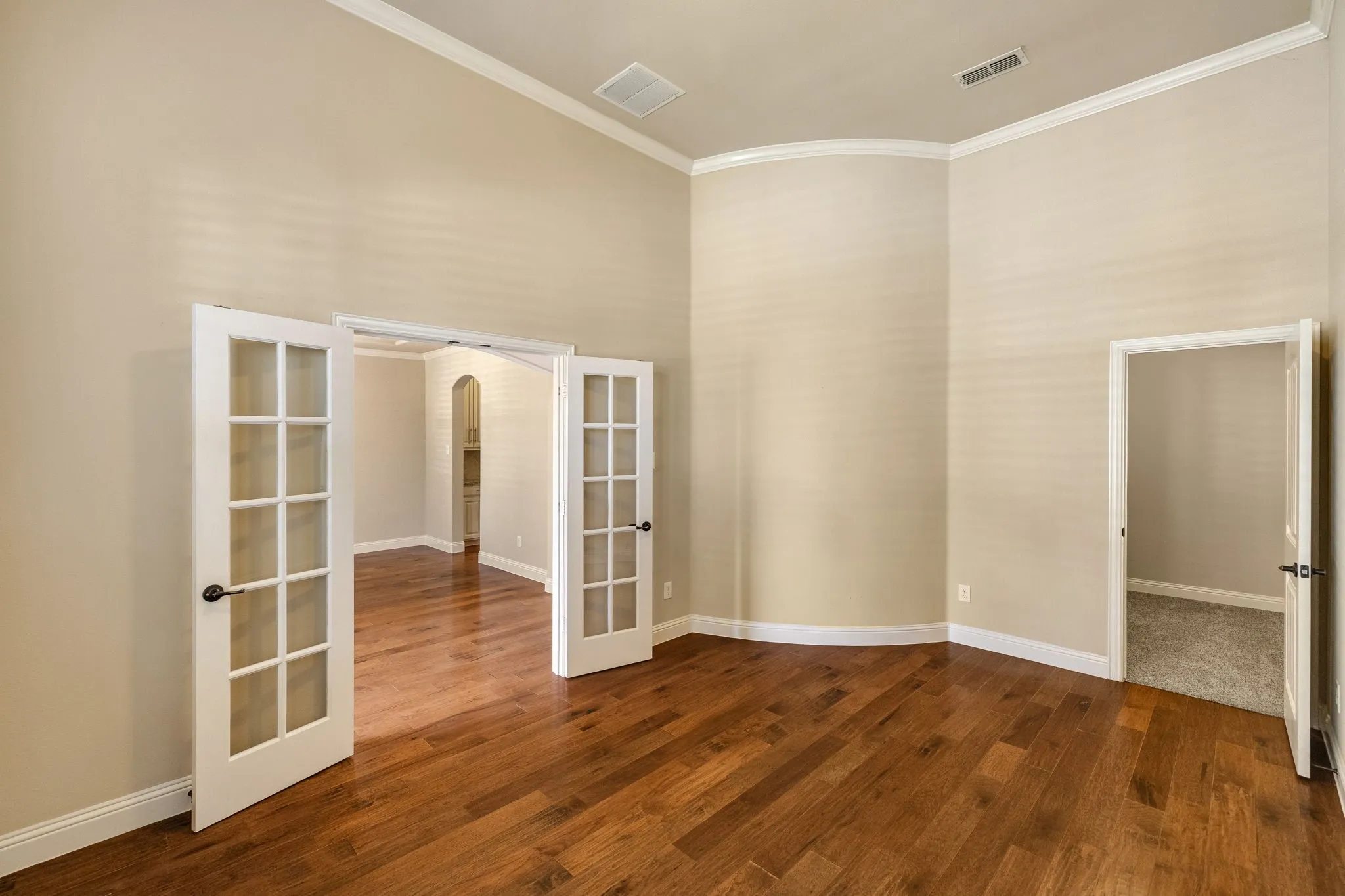 Hardwood-finish flooring, crown molding, French doors with glass panels, high ceilings. HUGE walk in closet, could also be used as 5th bedroom.