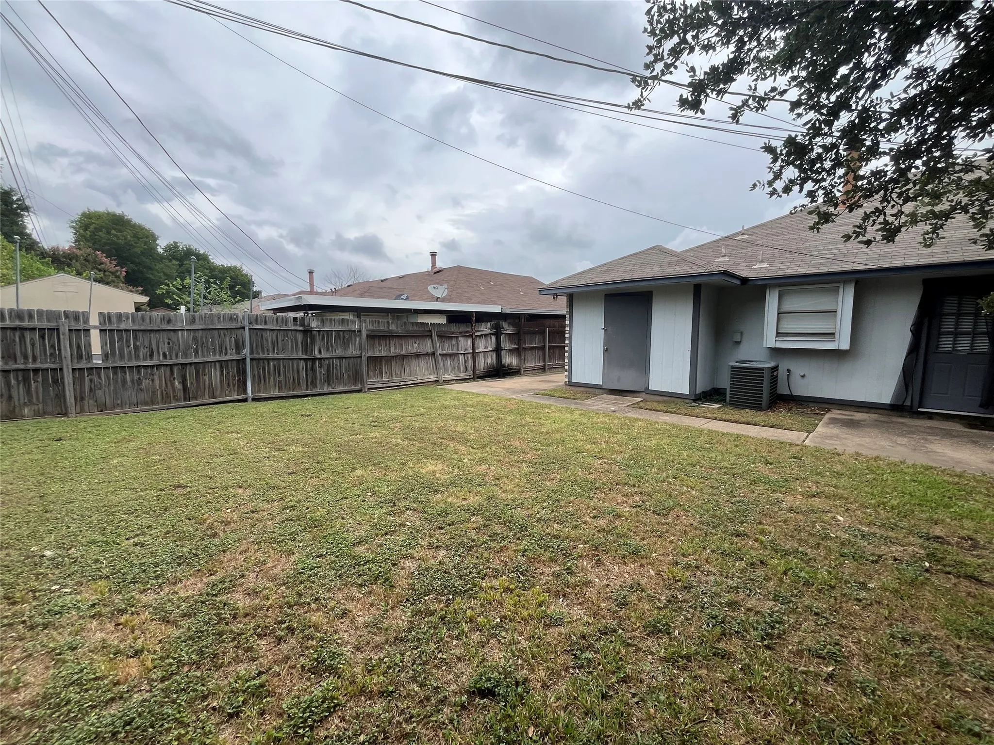 View of yard featuring central AC and a patio area
