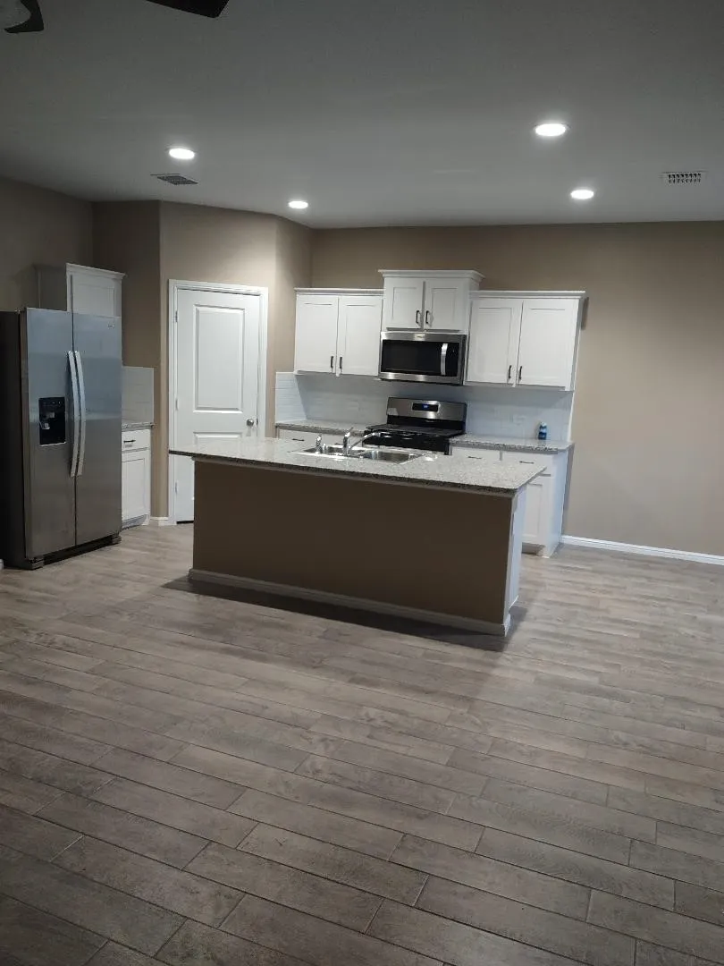 Open Kitchen with granite type countertop