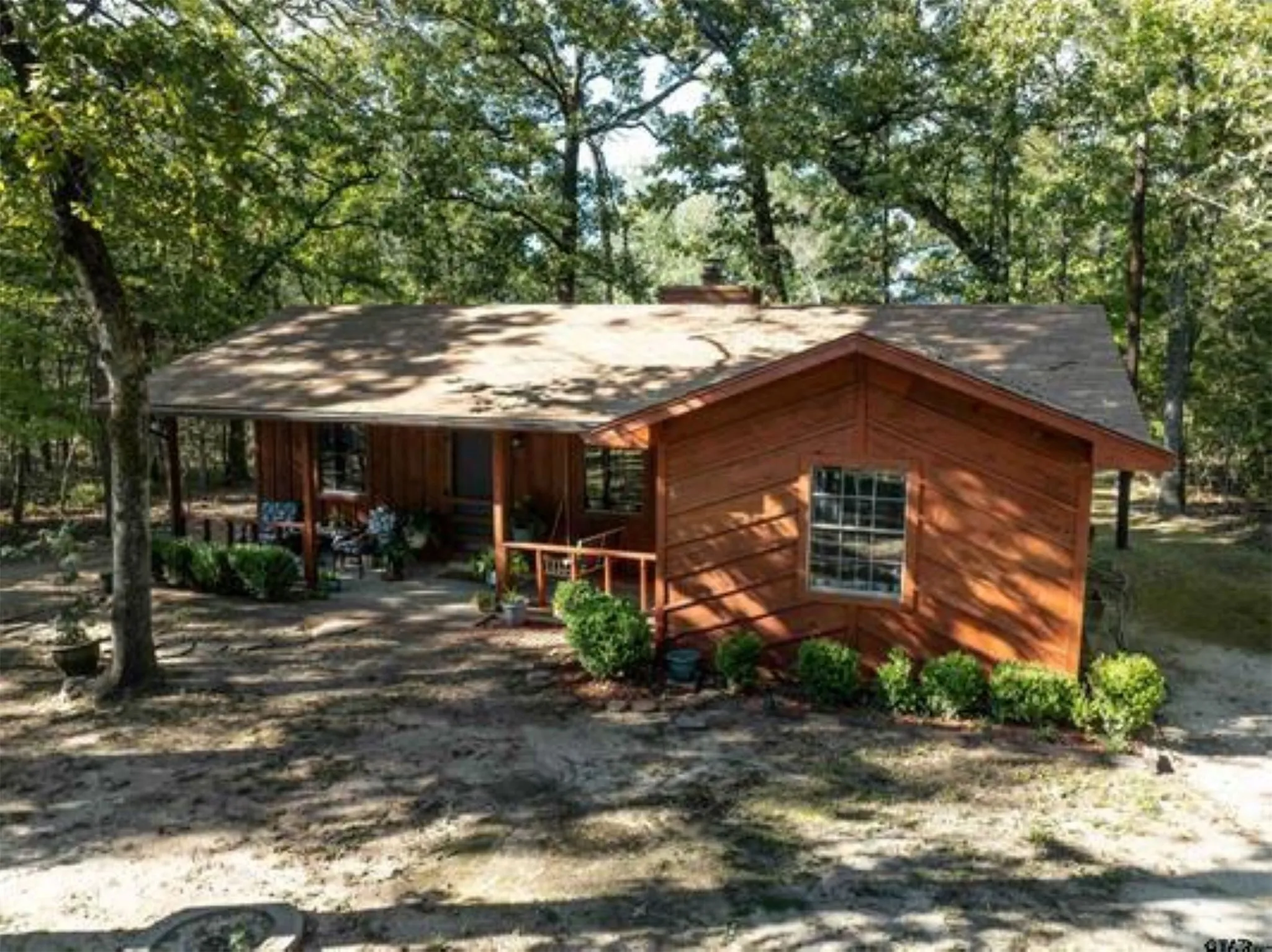 Cedar cabin with nice front porch.